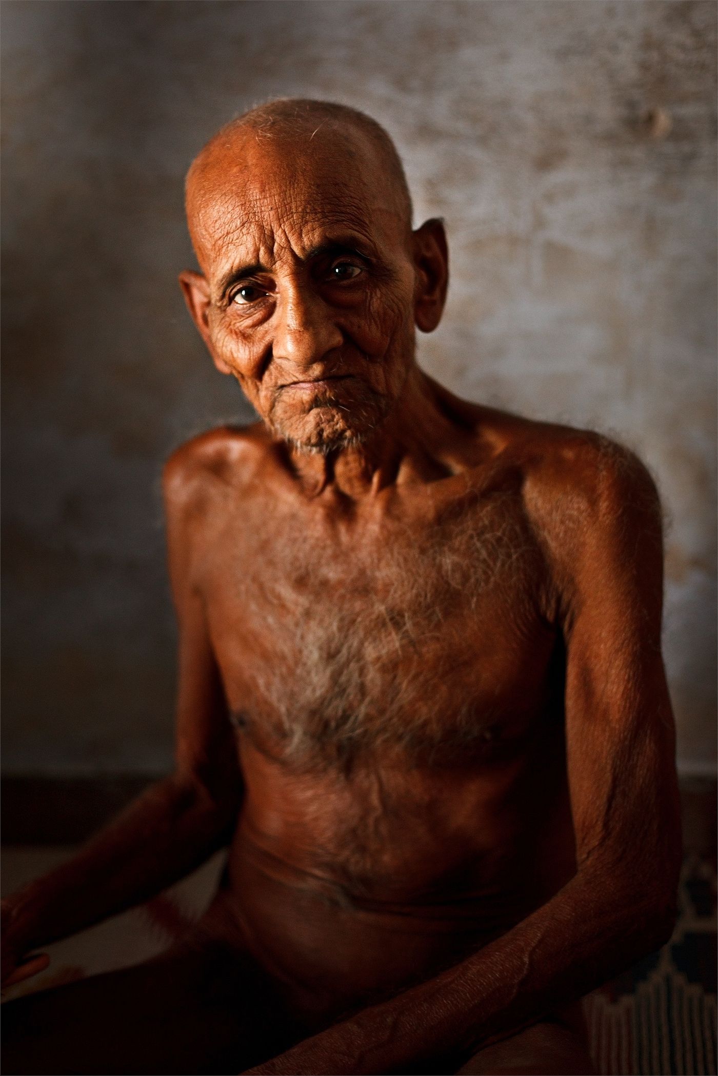 A serene portrait of a Digambara Jain monk, who has rejected all worldly possessions including clothing, in Sonagiri 