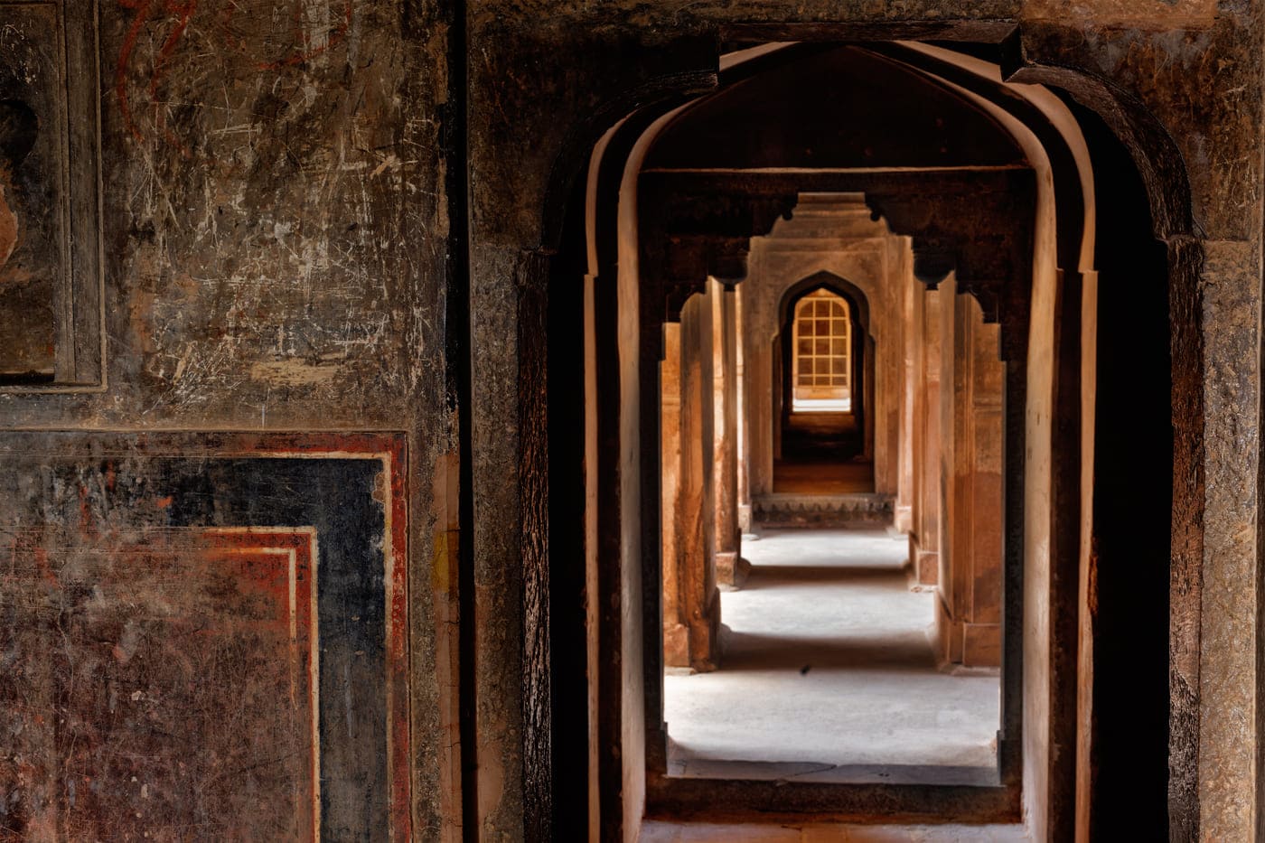 A shot of the perfectly architectured doorways that fall perfectly concurrent to each other at the Datia Palace, also known as Purana Mahal - meaning Old Palace - by locals, Madhya Pradesh 