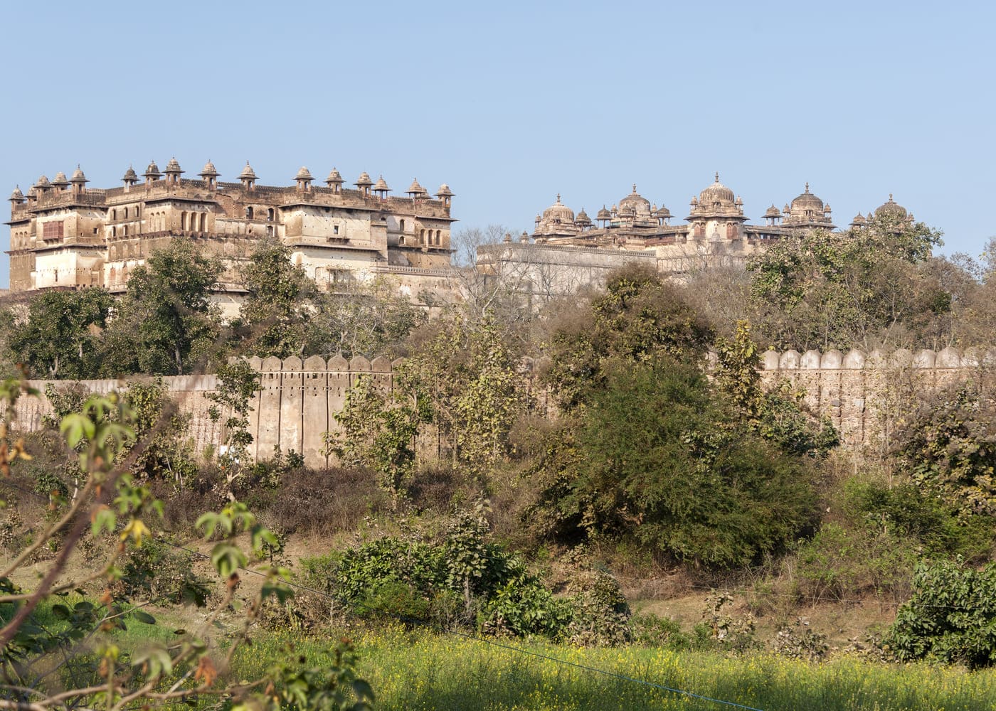 A side view of Raja Mahal and Jehangir Palace, built by Bundela Rajputs, located within the Orchha Fort Complex 