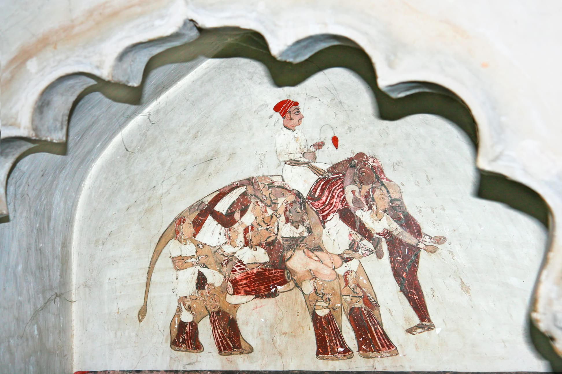 In the olden days, painters were not allowed to add their names to their paintings. This painting is literally an autograph done by a master artist. In it we see the figure of an elephant in the distance, but on closer inspection it becomes clear that every body part of the elephant is formed by the figures of twelve women. Some of them are playing musical instruments, while others are depicted in dancing poses, Orchha 