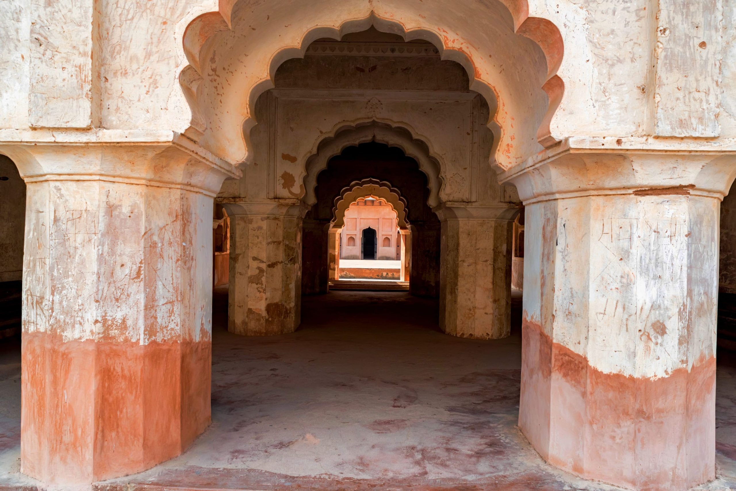 Looking through the imposing archways of Raj Mahal situated in the Orchha Fort complex 