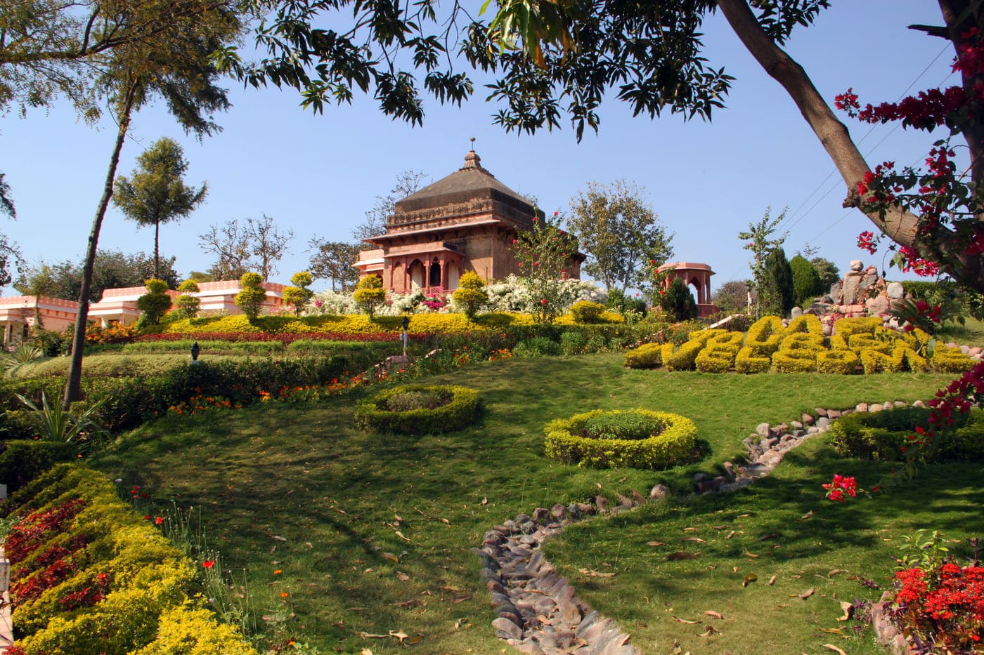 Picturesque garden of Betwa Retreat resort, situated on a hillock and overlooking the tranquil Betwa river, in Orchha 