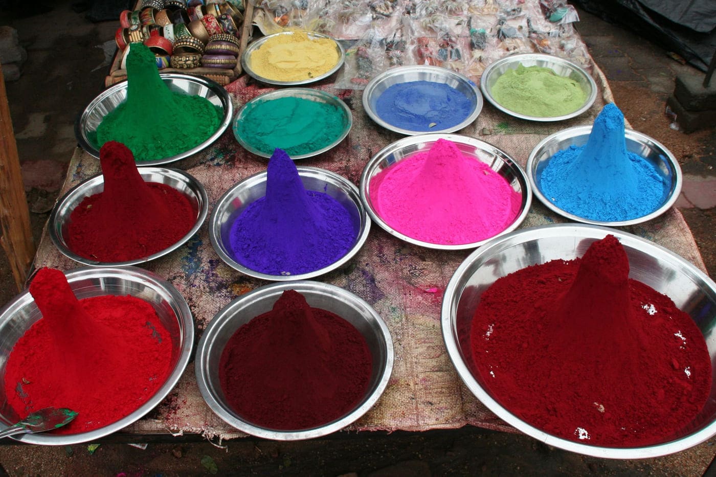 Selling colourful powder for worshipping purpose outside Ram Raja Mandir in Orchha 