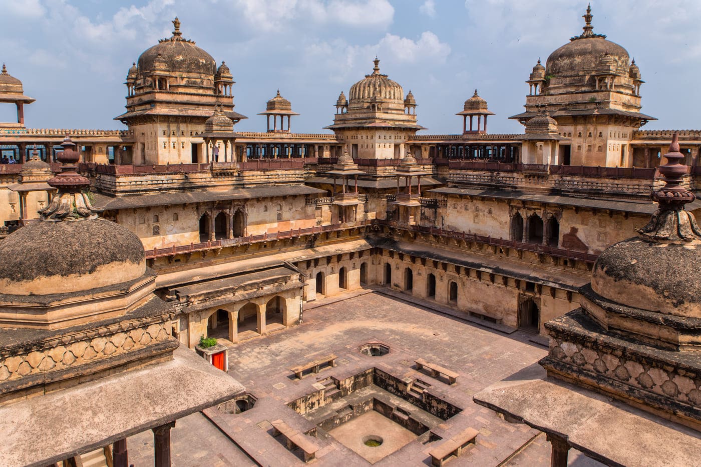 Several doors surrounding the courtyard of Jehangir Mahal (Orchha Fort) in Orchha. In middle is the ancient Fountain 