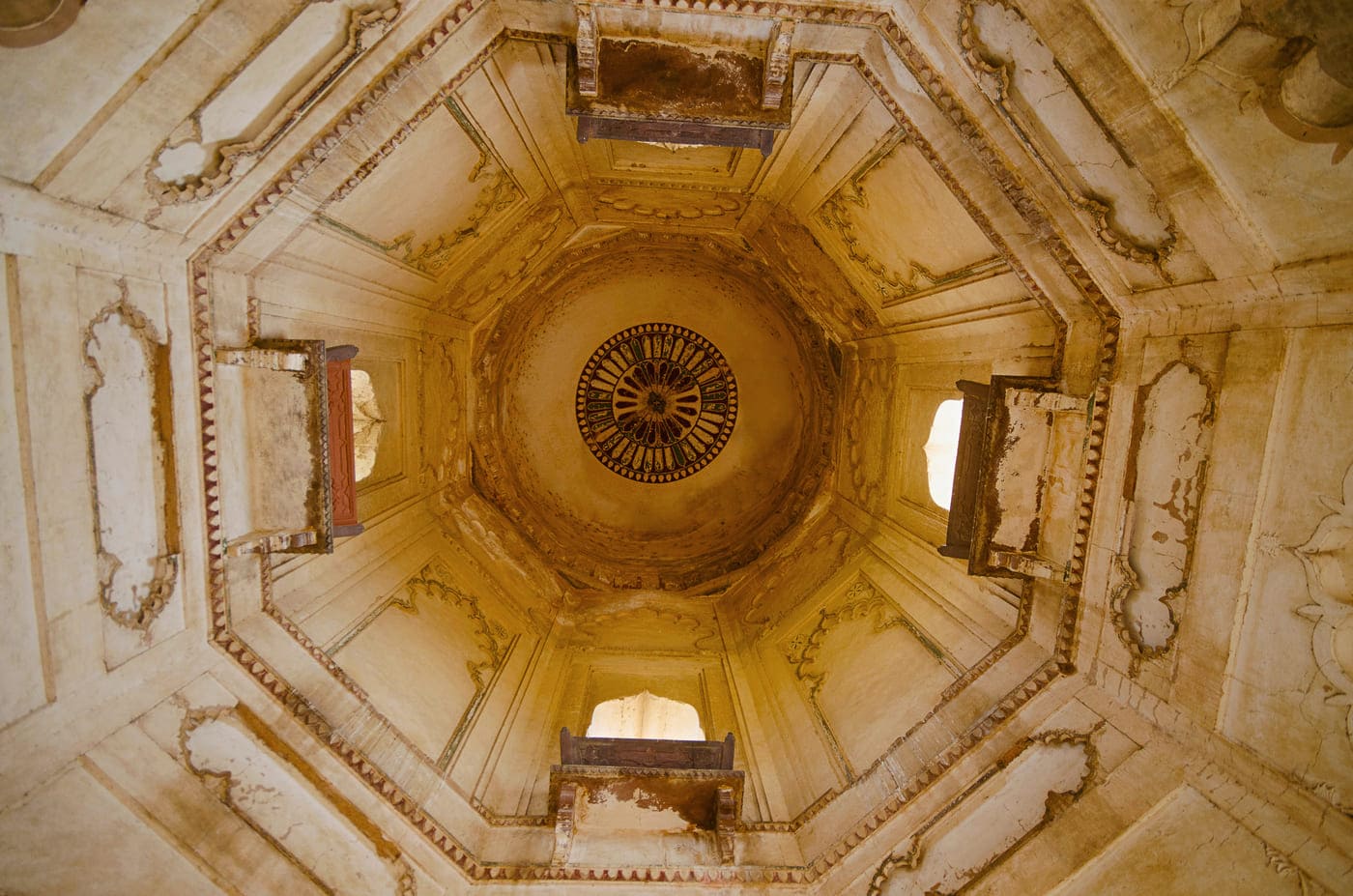 The complex and intricate painting on the round ceiling of a chhatri at an ancient royal structure of the Bundela kings of Orcha