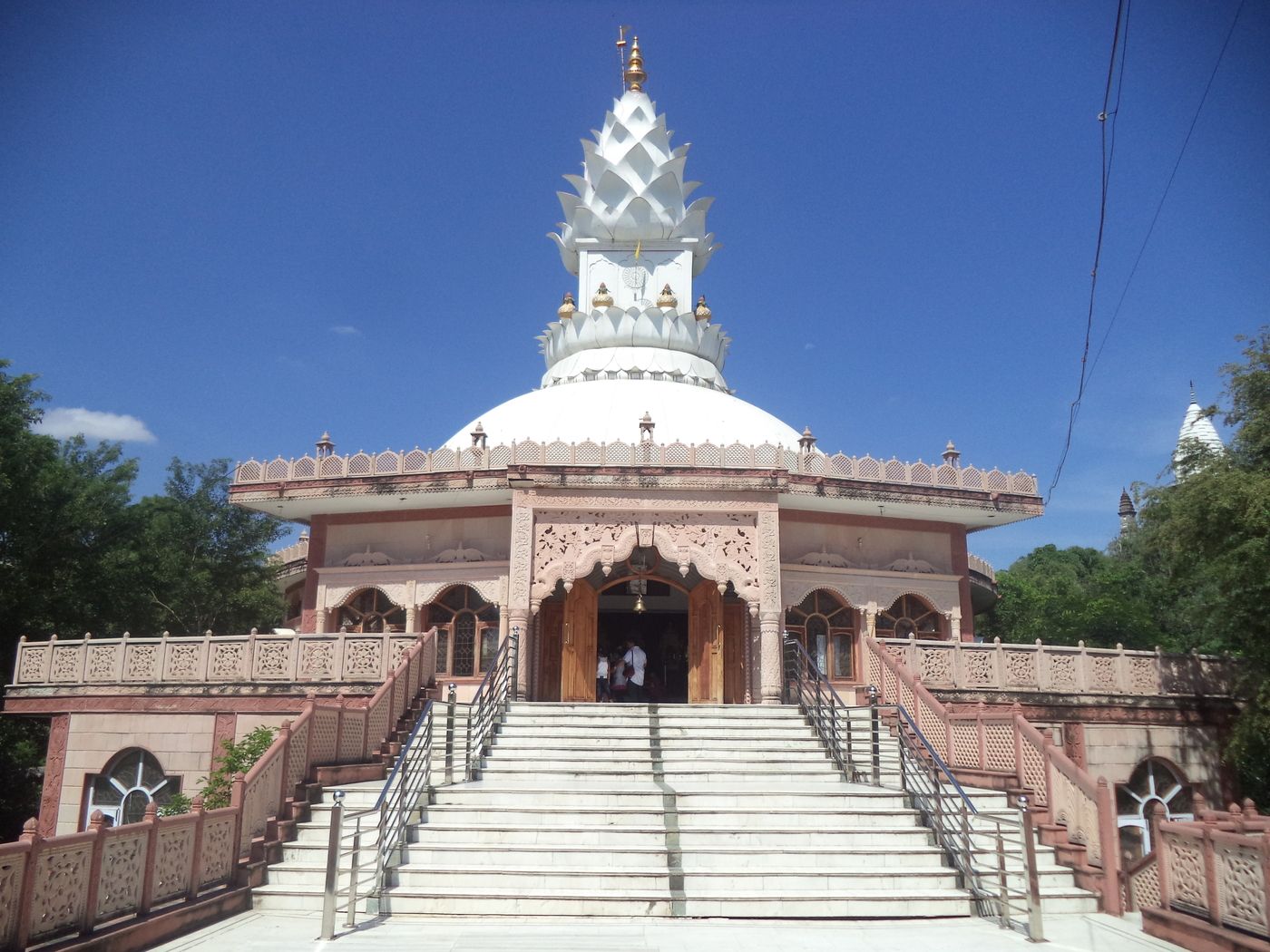 The facade of Lotus Temple in Sonagiri along with the majestic stairway leading to the entrance