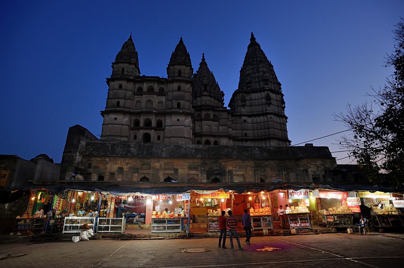 The night market under the ancient Chaturbhuj Temple in Orchha overlooking the beautiful sky. The market is the perfect place to roam around after you are done visiting all the temples in the city 