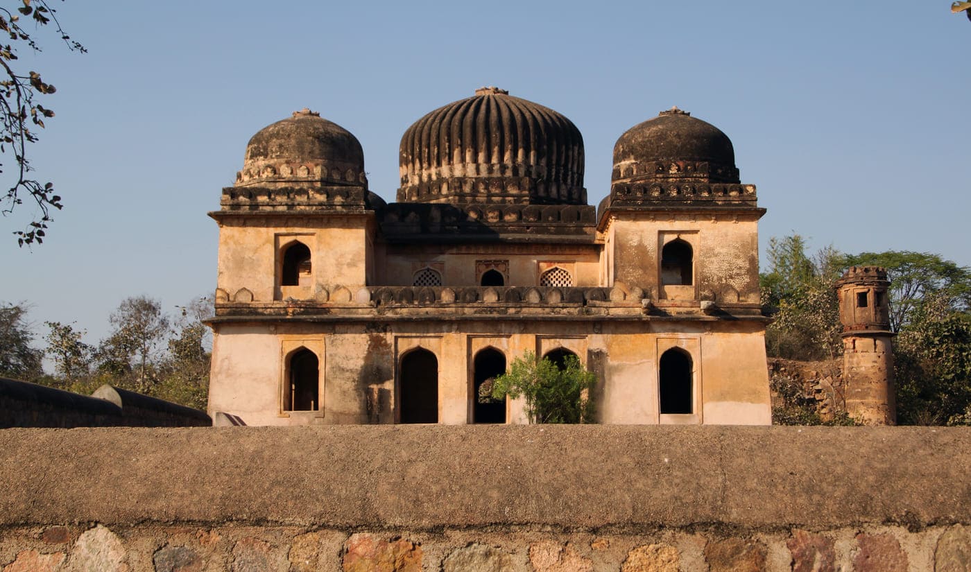 The rocks that were used in the building of the Bundela Kings’ palace in Orchha have discoloured with the wear and tear of time, yet they stand majestic as a reminder of the lands’ power © Goddard_Photography / Getty Images