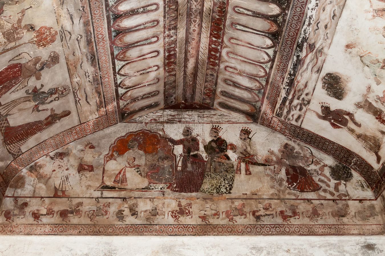 Two different reincarnations of Lord Vishnu depicted on the front wall. On the left is Lord Ram with his consort Sita, and in the corner the sixth avatar of Vishnu as Parashurama, or Rama with an axe, Orchha