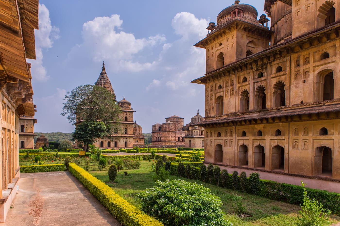 Well maintained lush gardens keep the ageless charm of the complex of temple Chhatris that were built in the 17th century in memory of the ruler of the Orchha city