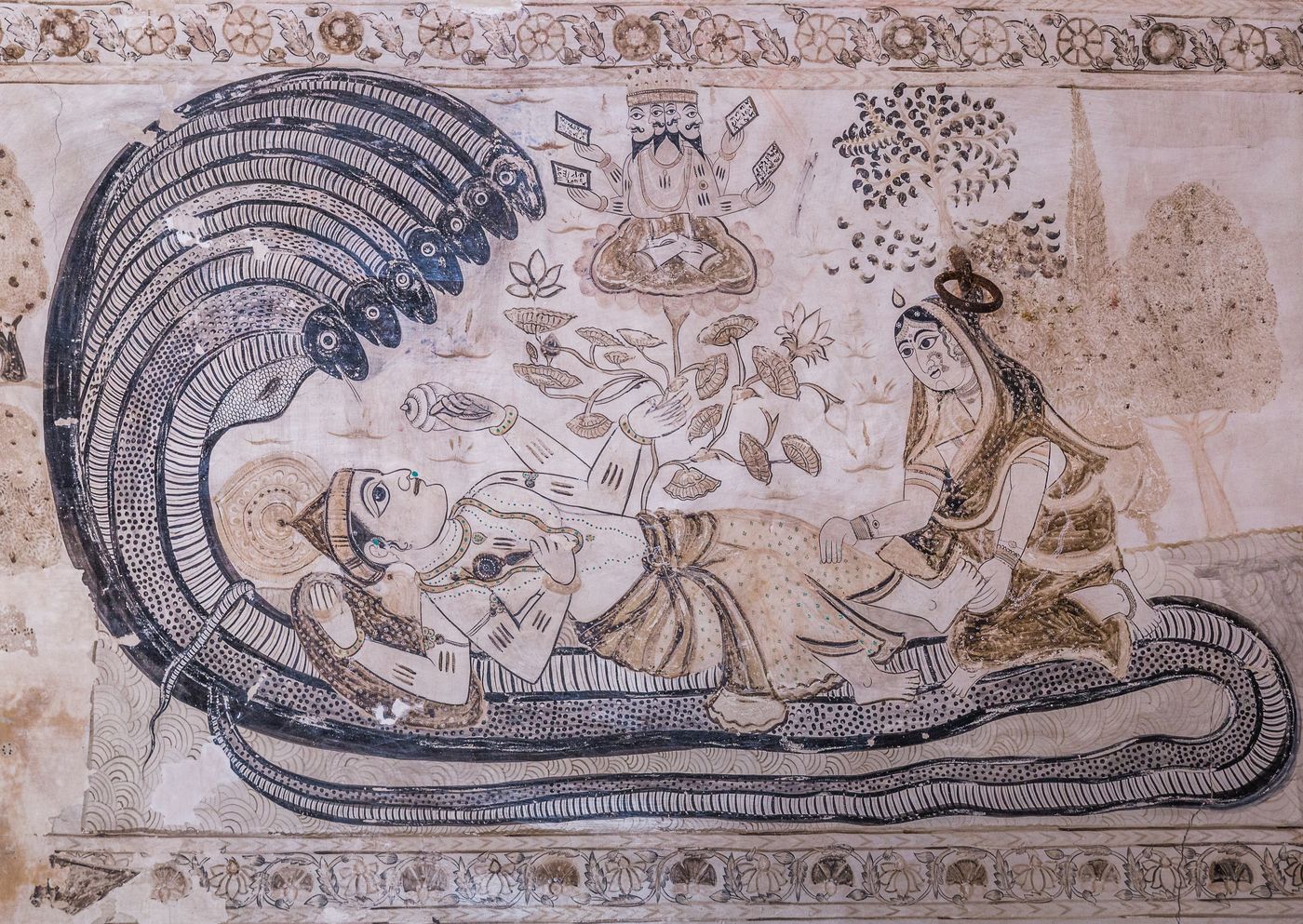 A beautiful depiction of Lord Vishnu resting on Sheshanaga, a seven headed cobra, while his consort Lakshmi is massaging his leg, Orchha 