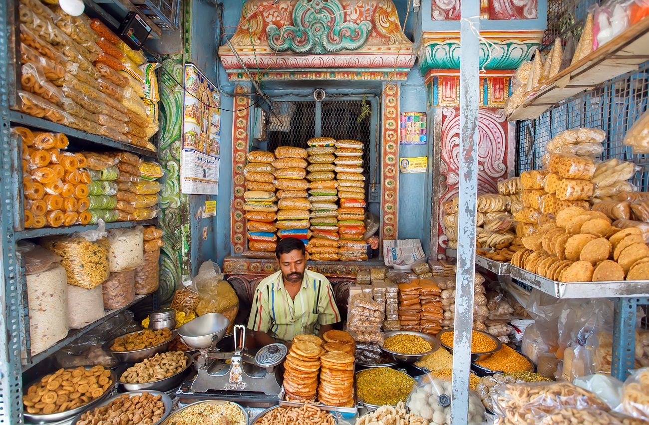 A glimpse of a sweet shop where the owner waits for buyers in his shop which is filled with different varieties of snacks. The Silicon Valley of India, Bangalore is the third most populous Indian city with a population of 8.52 million 