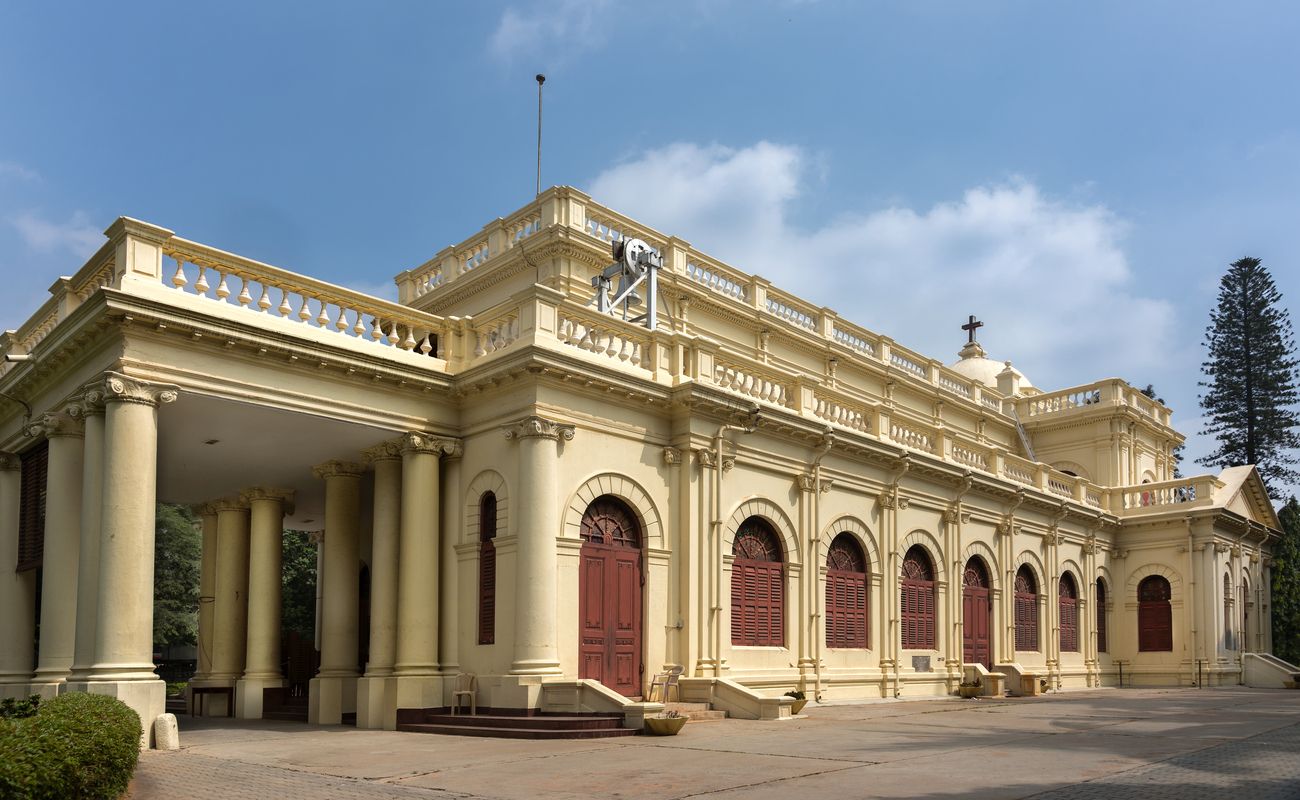 A majestic view of Anglican Saint Mark's Cathedral which is known to be wonderful in terms of old European architecture and for all the large trees surrounding it in Bengaluru 