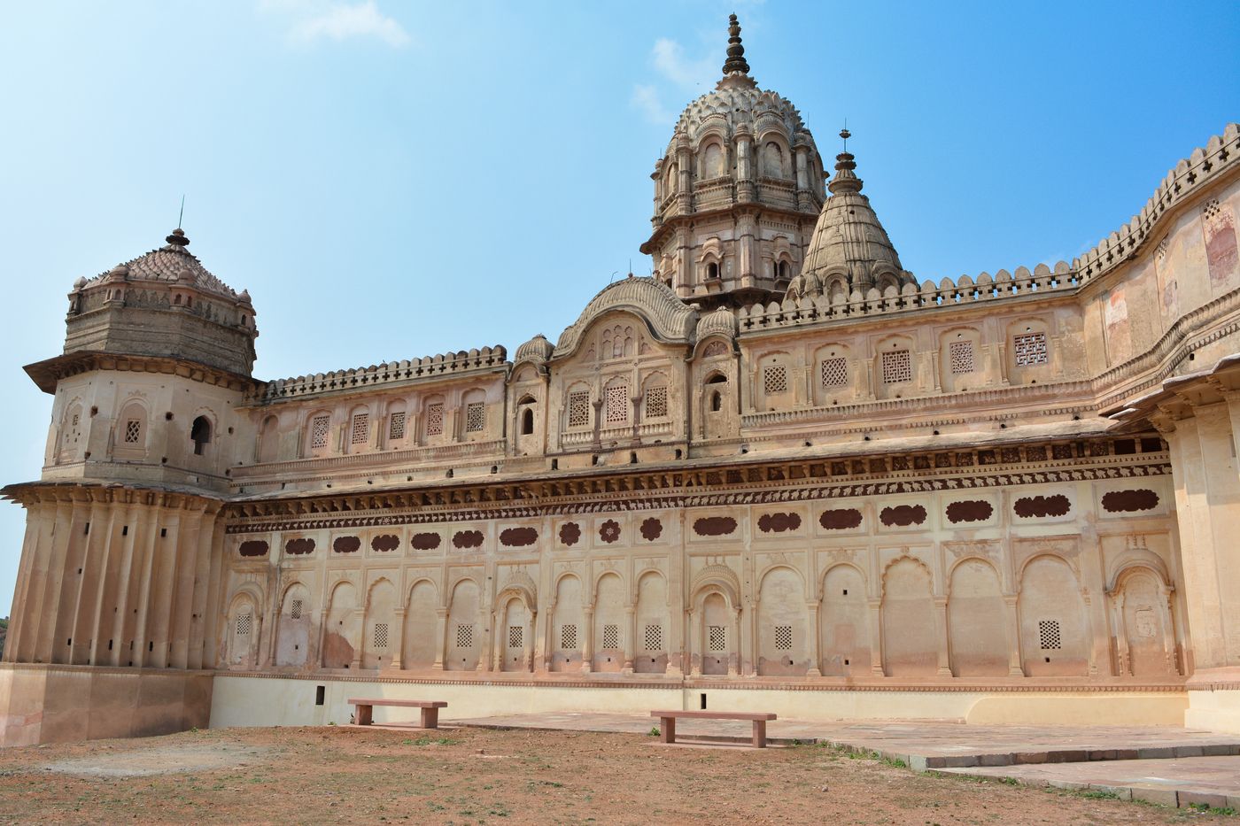 A panoramic view of the exquisite architecture of Lakshmi Narayan temple in Orchha, lined with jharokhas and pillars