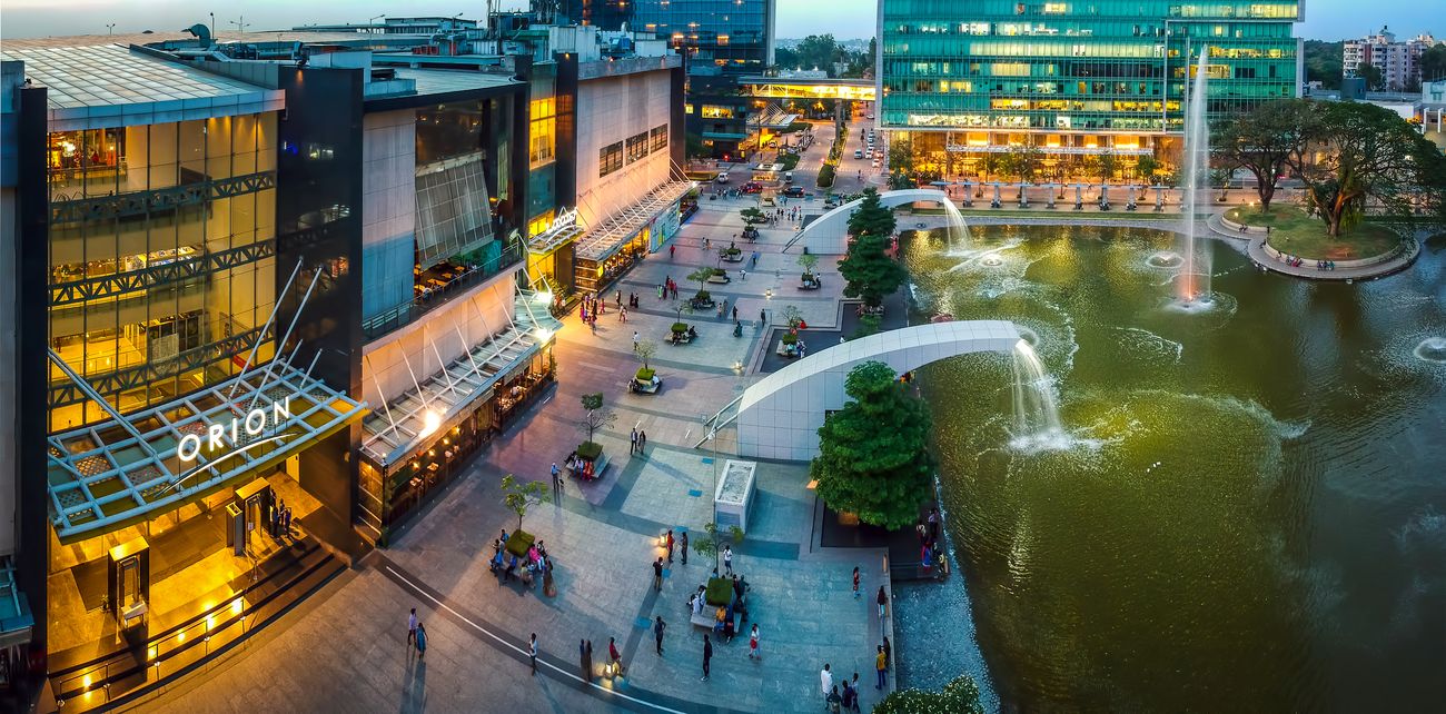 A grand aerial panoramic view of the Orion Mall which is a world-class mall in every facet. It has set high standards across construction, architecture, consumer experience and marketing in Bangalore