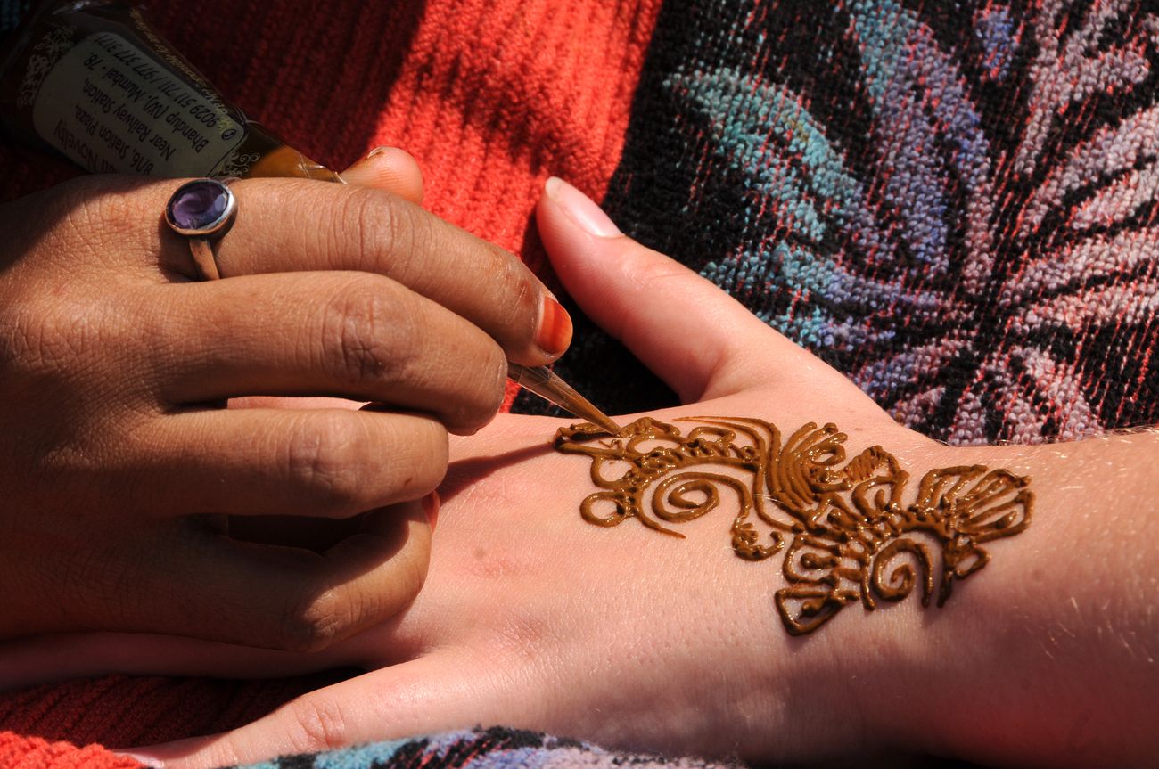 A woman puts designer henna on a girl’s hand during the Kala Ghoda Arts Festival in Mumbai, Maharashtra, India. The annual Kala Ghoda Arts Festival is the most popular cultural festival and is well liked for its edgy installations, performances and discussions
