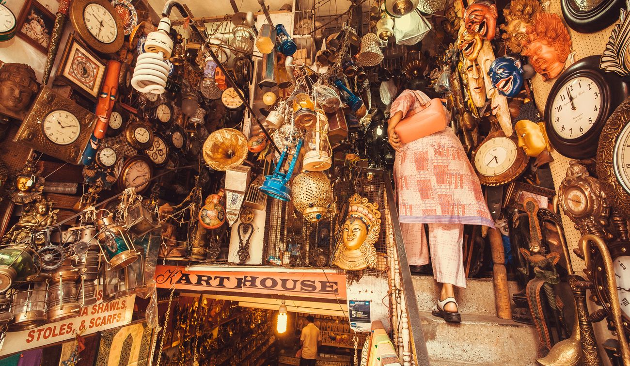 A woman walks in a pretty store with vintage furniture, art objects and antiques located at a second-hand market. The Silicon Valley of India, Bangalore is the third most populous Indian city with a population of 8.52 million.