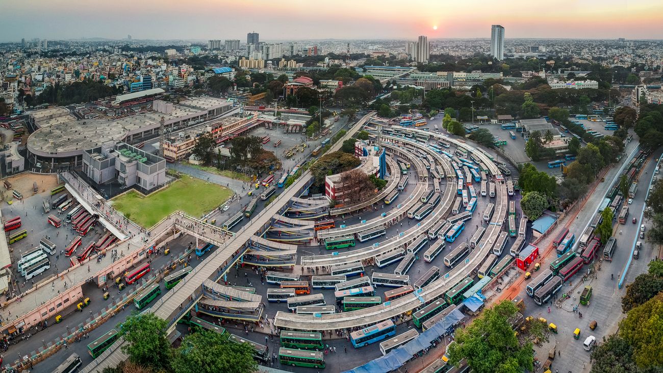 An aerial panoramic view offers a grand sight of Majestic City Bus-stand, Kempegowda Metro Station, KSRTC Bus-stand and City Railway Station at the time of sunset