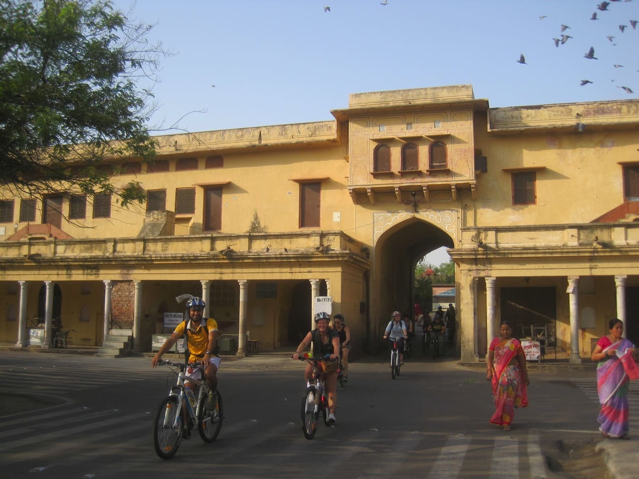 Cyclists riding through the city of Jaipur