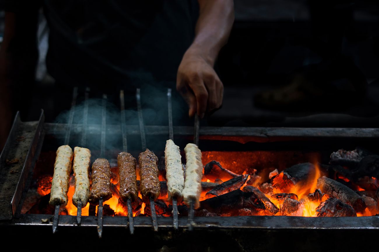 Fiery Seekh Kebabs which are Ramzan delicacies served in mosque road during Ramzan Food Mela at Frazer town in Bangalore