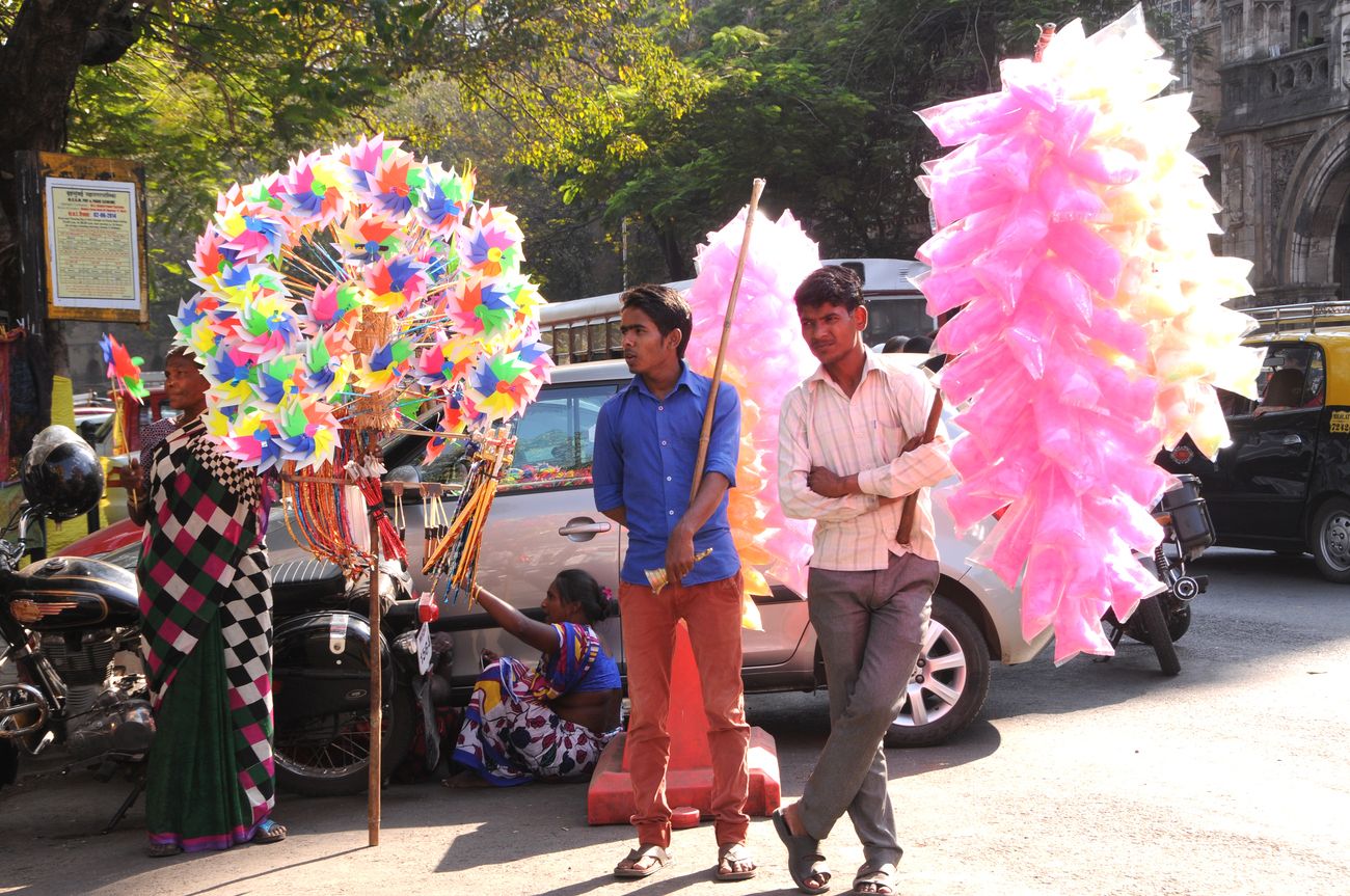 Street vendors selling cotton candies and paper fans for the enjoyment of kids during the Kala Ghoda Arts Festival in Mumbai. The annual Kala Ghoda Arts Festival is the most popular cultural festival and is well liked for its edgy installations, performances and discussions