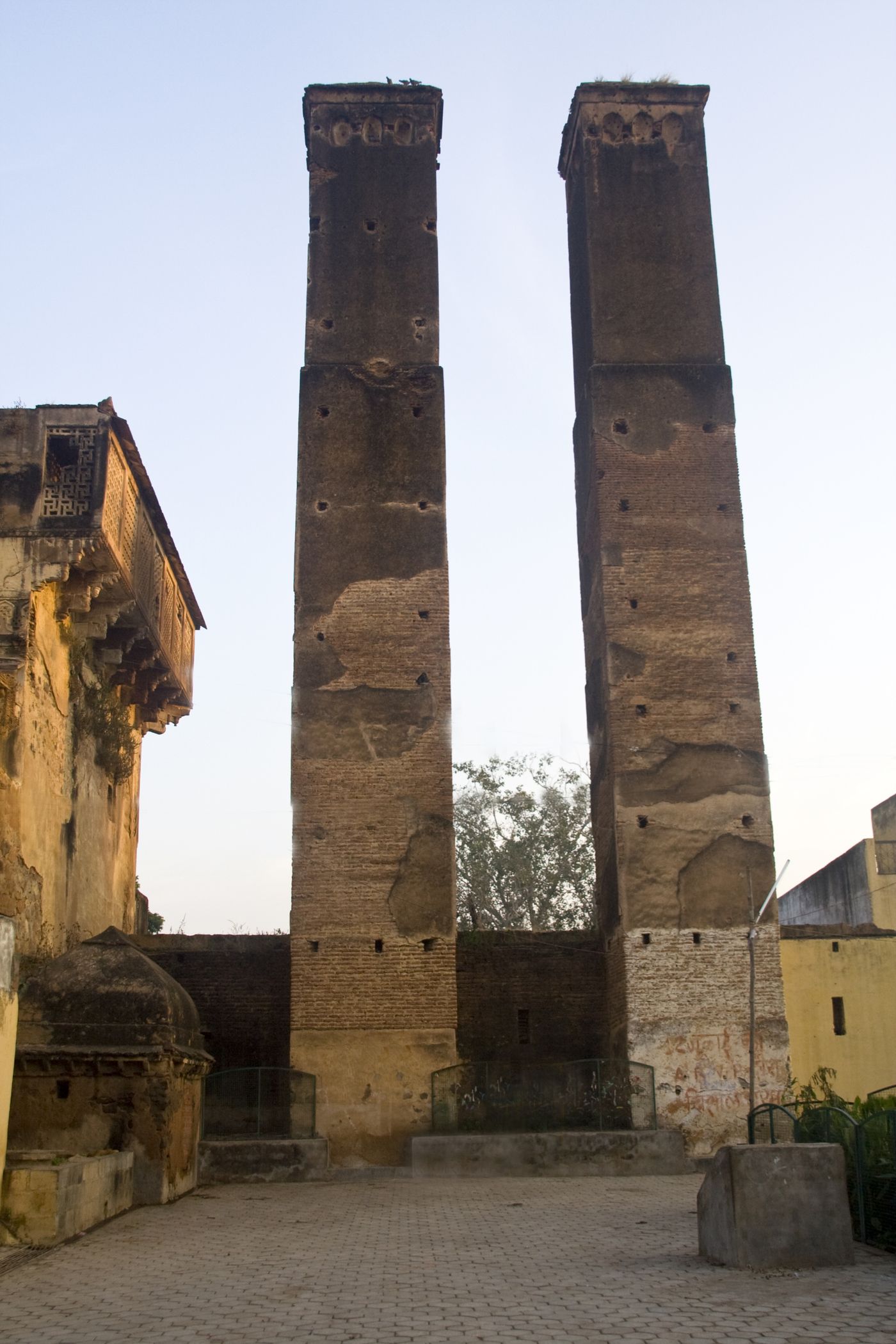 The imposing Sawan Bhadon Pillars in Phool Bagh, Orchha, an ingenious system for cooling the air through the perforated top to gather wind and the bottom of the pillars connected to a water reservoir