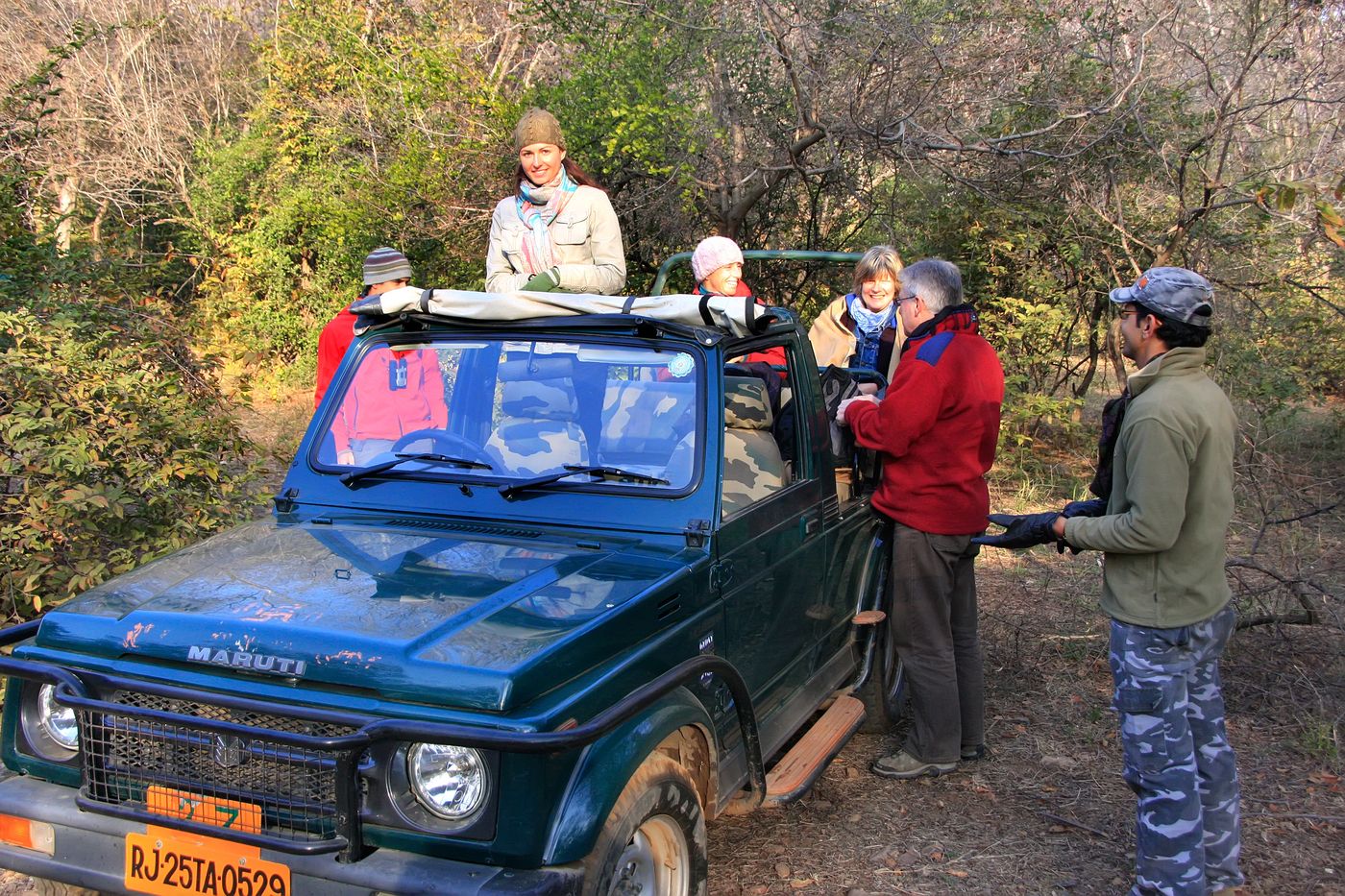 Tourists accompanied by their guide on a safari in Ranthambore Reserve, amongst the largest parks in the state of Rajasthan