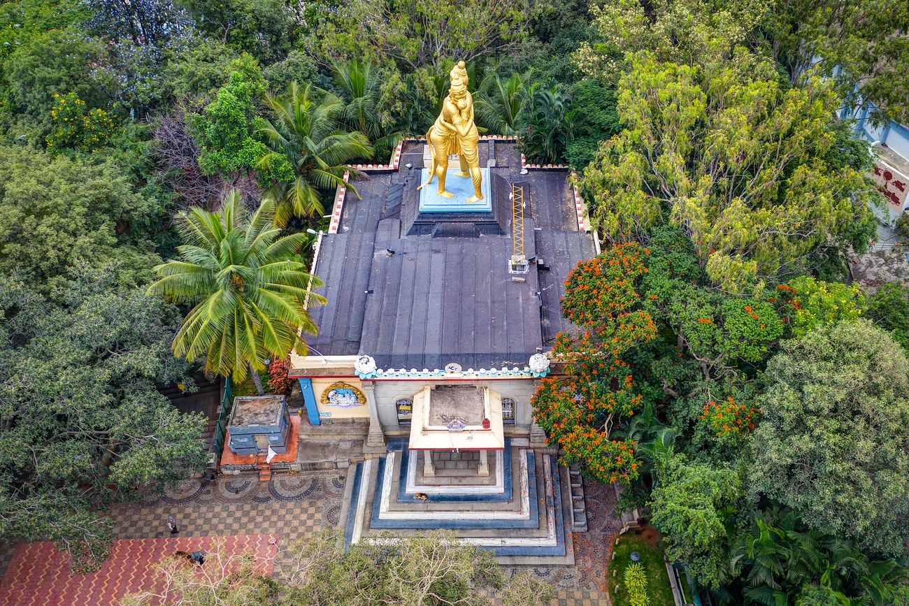 A beautiful aerial view of the old Ramanjaneya Hindu Temple at Hanumanthanagar, Bangalore. This Temple is located atop Ramanjaneya Hill adjacent to KH Kalasoudha and Hanumanthanagar Park, surrounded with lush green trees all around