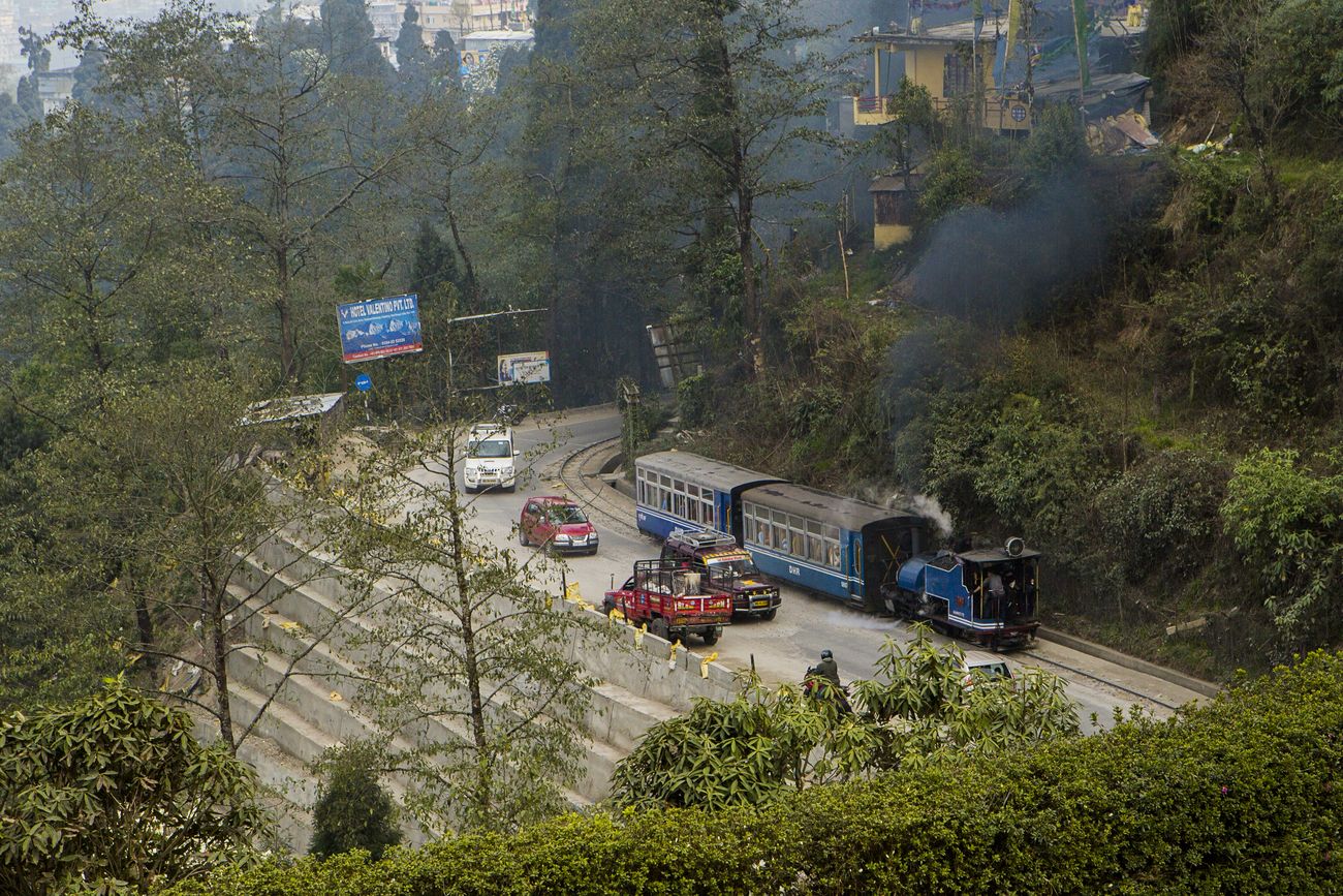 A bird’s eye view of the tracks of the Darjeeling Toy Train which at many points travels right by the vehicles on the highways of the Darjeeling district