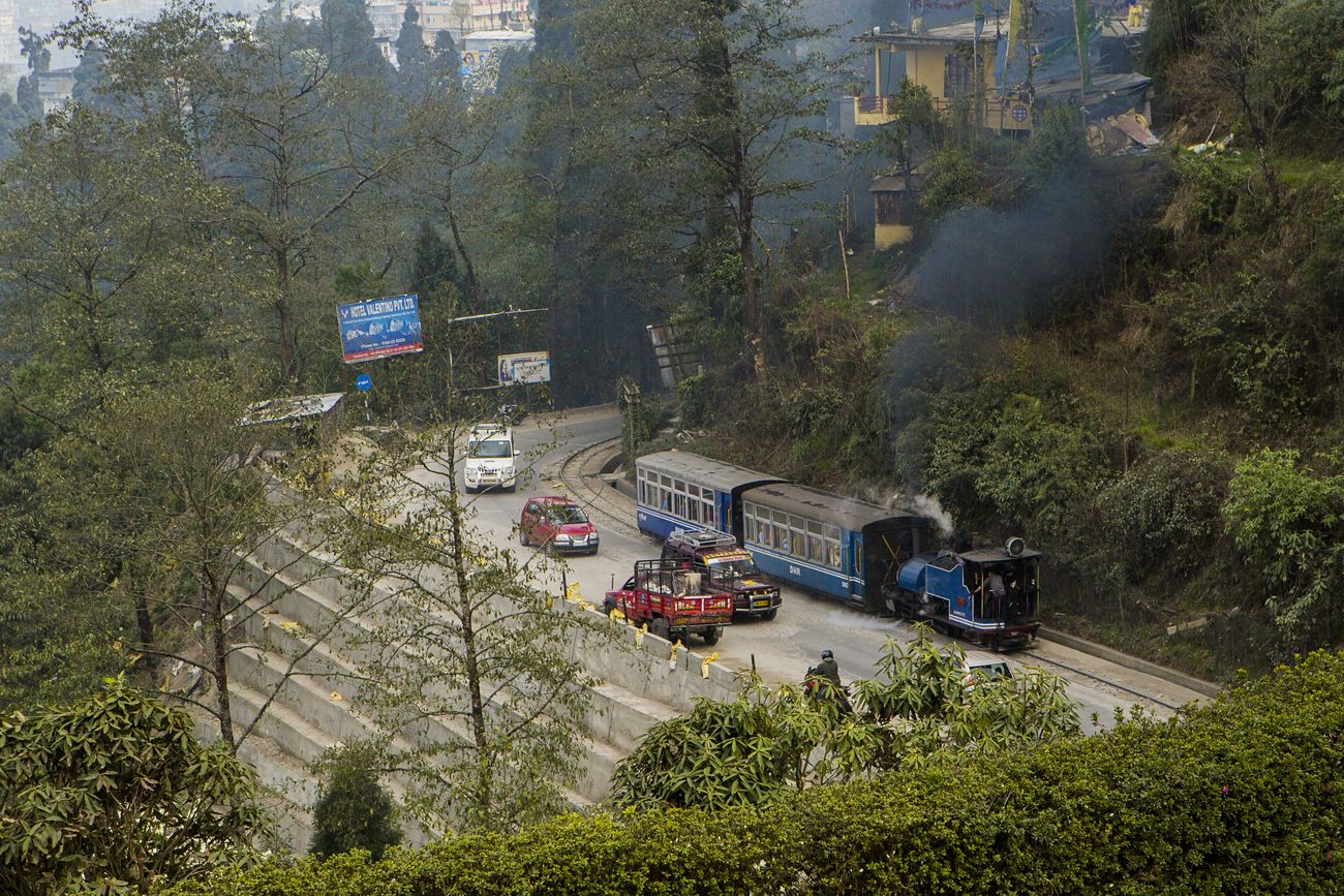 A bird’s eye view of the tracks of the Darjeeling Toy Train which at many points travels right by the vehicles on the highways of the Darjeeling district 