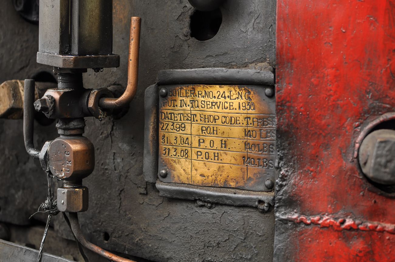 A close up shot of the information on the engine of the Toy Train with important information regarding the engine for maintenance staff