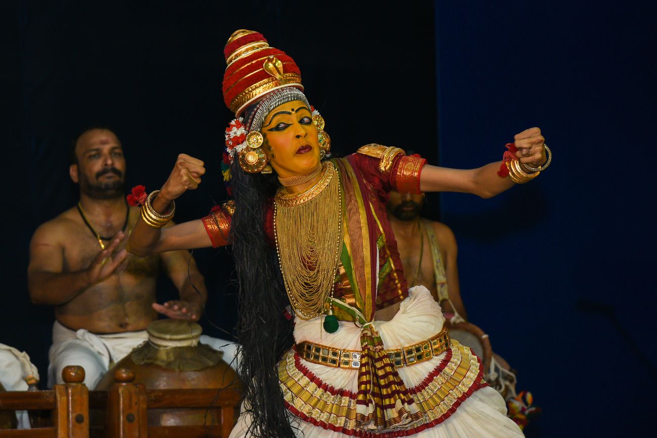 A female dancer performs the renowned dance form Koodiyattam on the stage; Koodiyattam combines elements of ancient Sanskrit theatre with koothu, an ancient performance art.