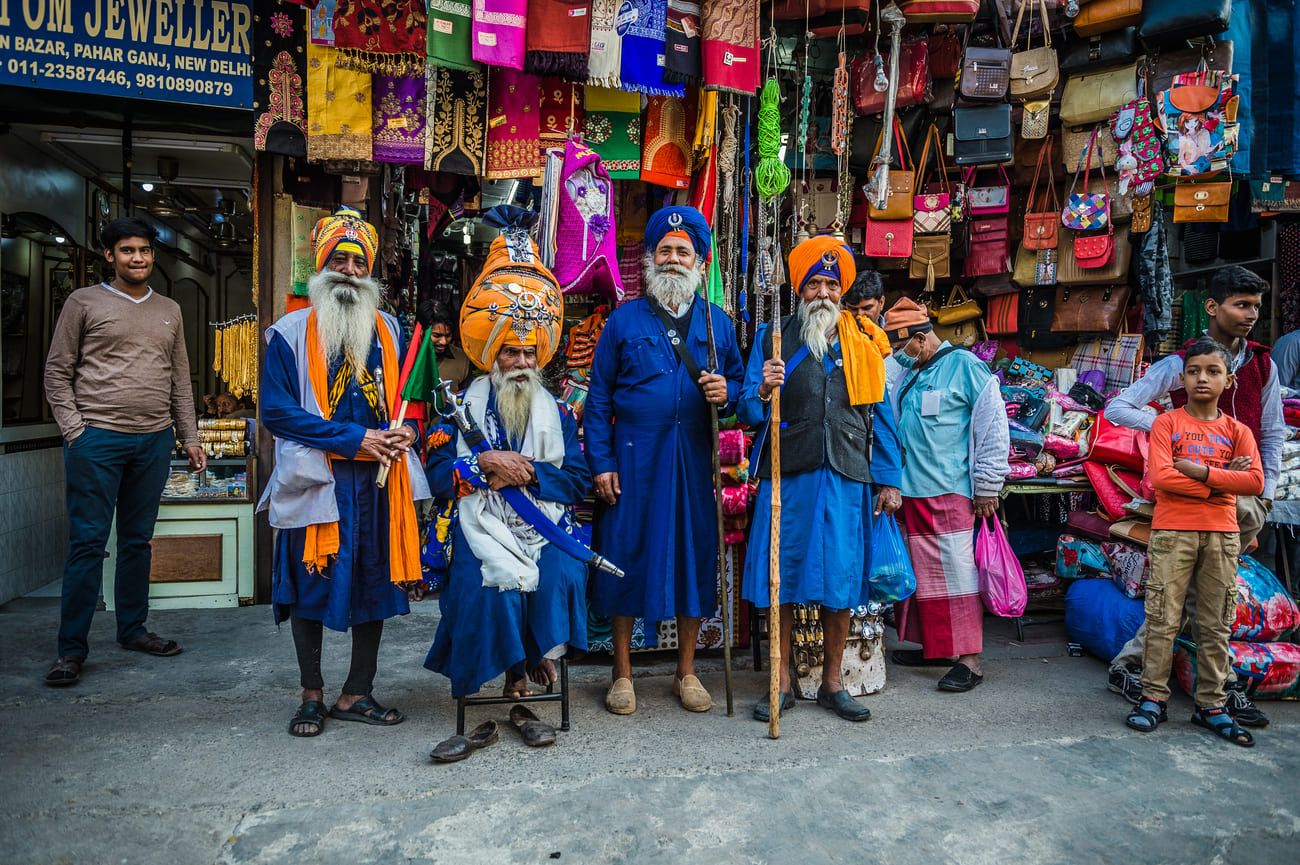 A group of proud Indian men in their traditional attire in the Gurudwara Bangla Sahib in New Delhi
