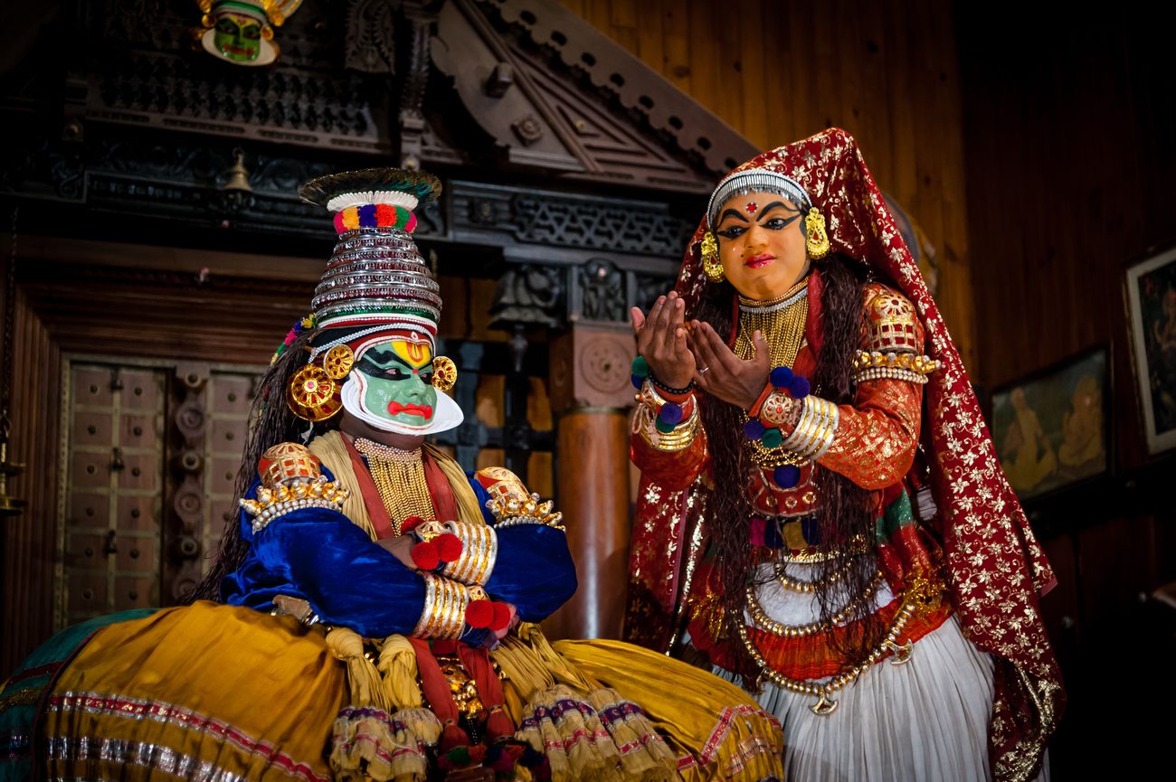 A Kathakali dance performance underway at Fort Kochi in Kerala; the dancer with their face painted green represents Pacha Vesham or the dignified male hero. 