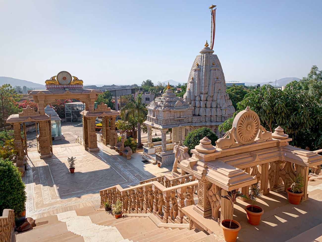 A sweeping view of the beautiful pink sandstone Dharmachakra Jain Temple near the Viholi Village