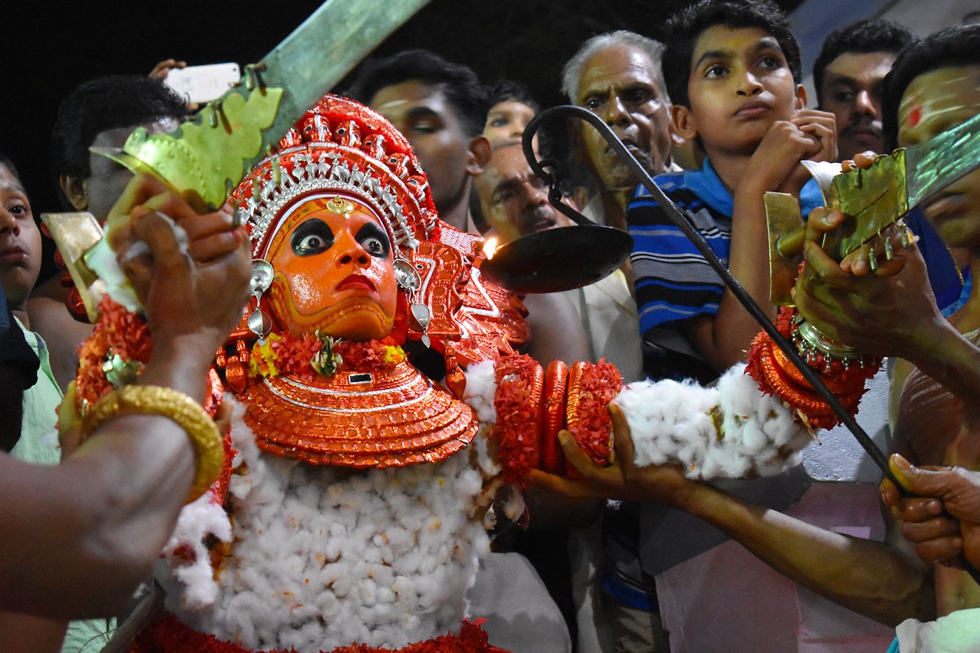 A Theyyam artist performs during the annual festival at Puliroopakaali temple in Ramapuram. Theyyam is a ritualistic folkart form of Kerala 