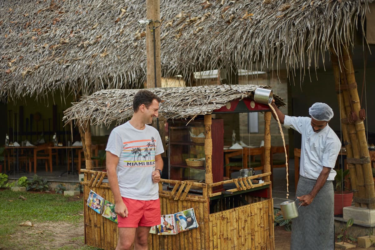 A tourists having fun at a Masala Tea stall at the Xandari Pearl Resort.