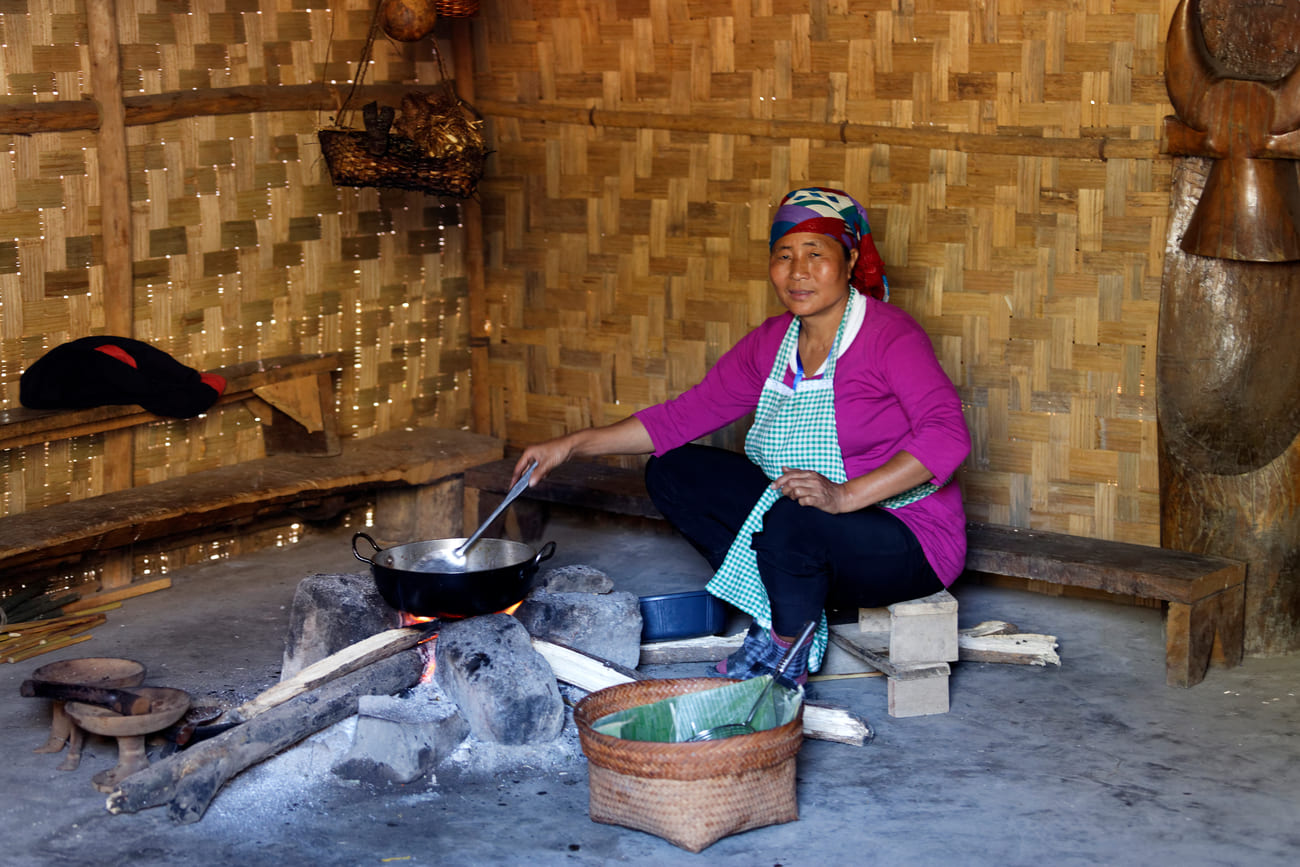 A tribeswoman preparing traditional food, Kisama Village, Nagaland. The festival is an opportunity for inter-tribal exchange of ideas and cultures 