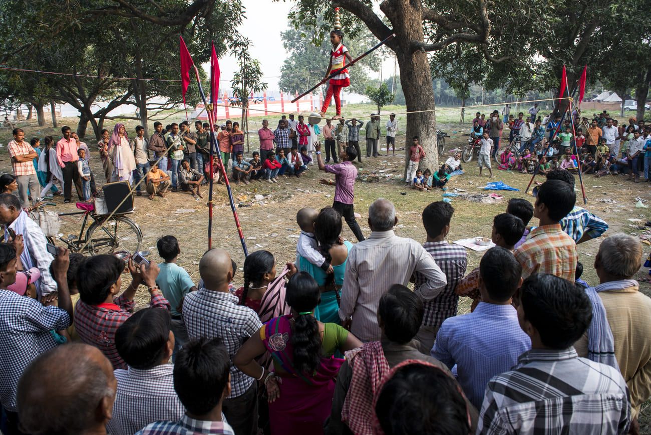 A young girl demonstrating her skills on the tight rope. Shows like these are quite common at fairs in India 