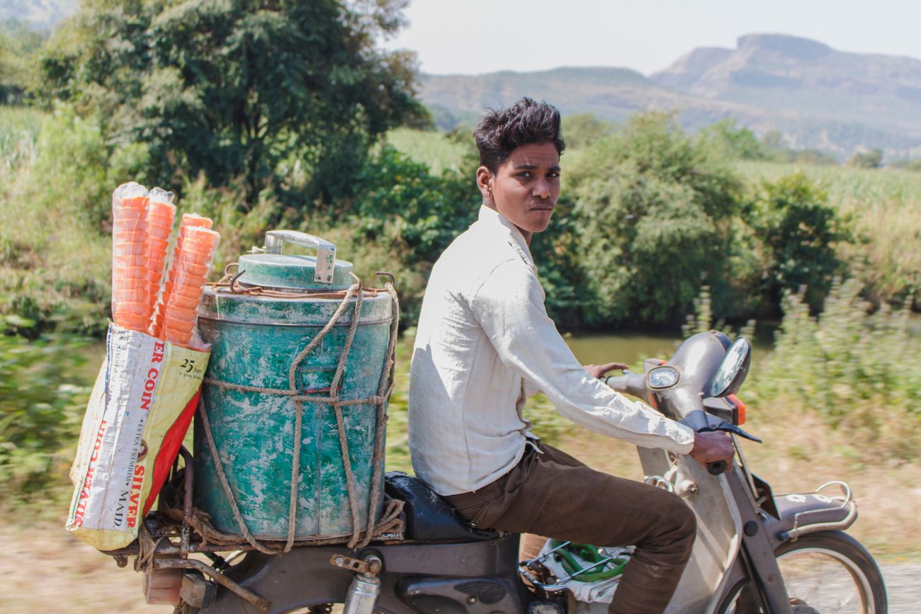 A young man transporting ice cream and cones to the Sula Vineyards