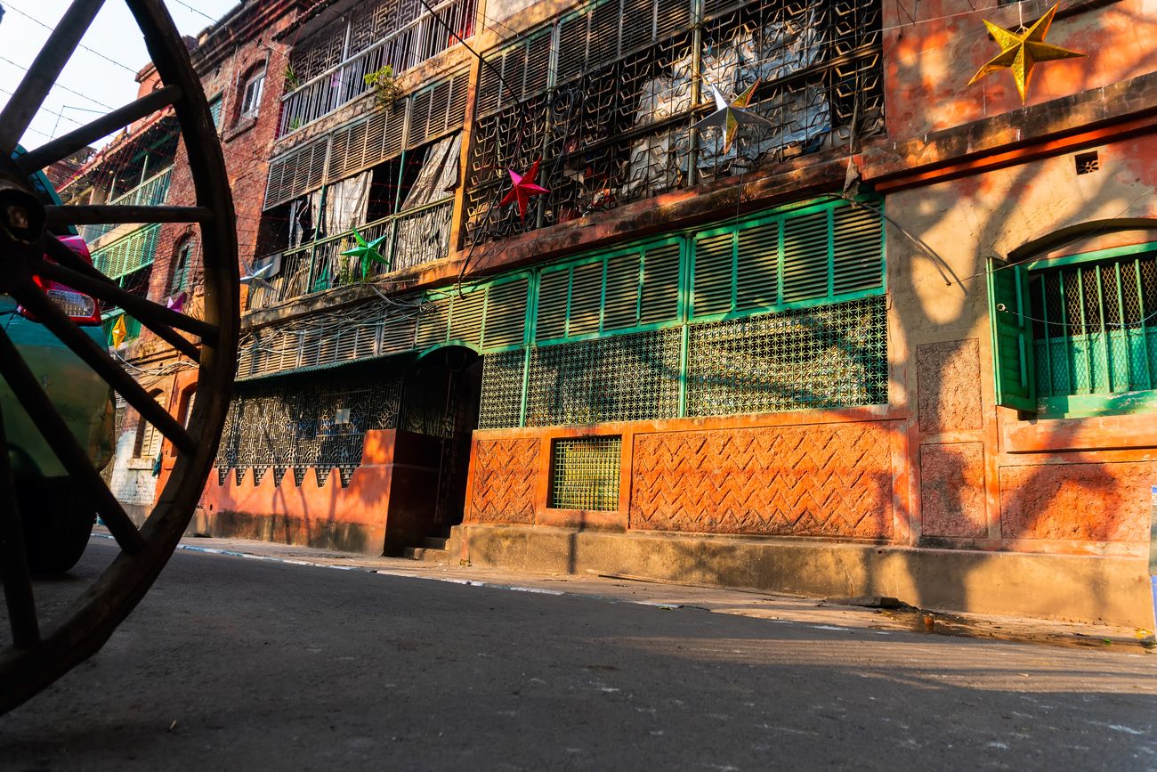 An old residential building with green windows tucked away in the lanes of Bow Barracks in Kolkata, West Bengal.