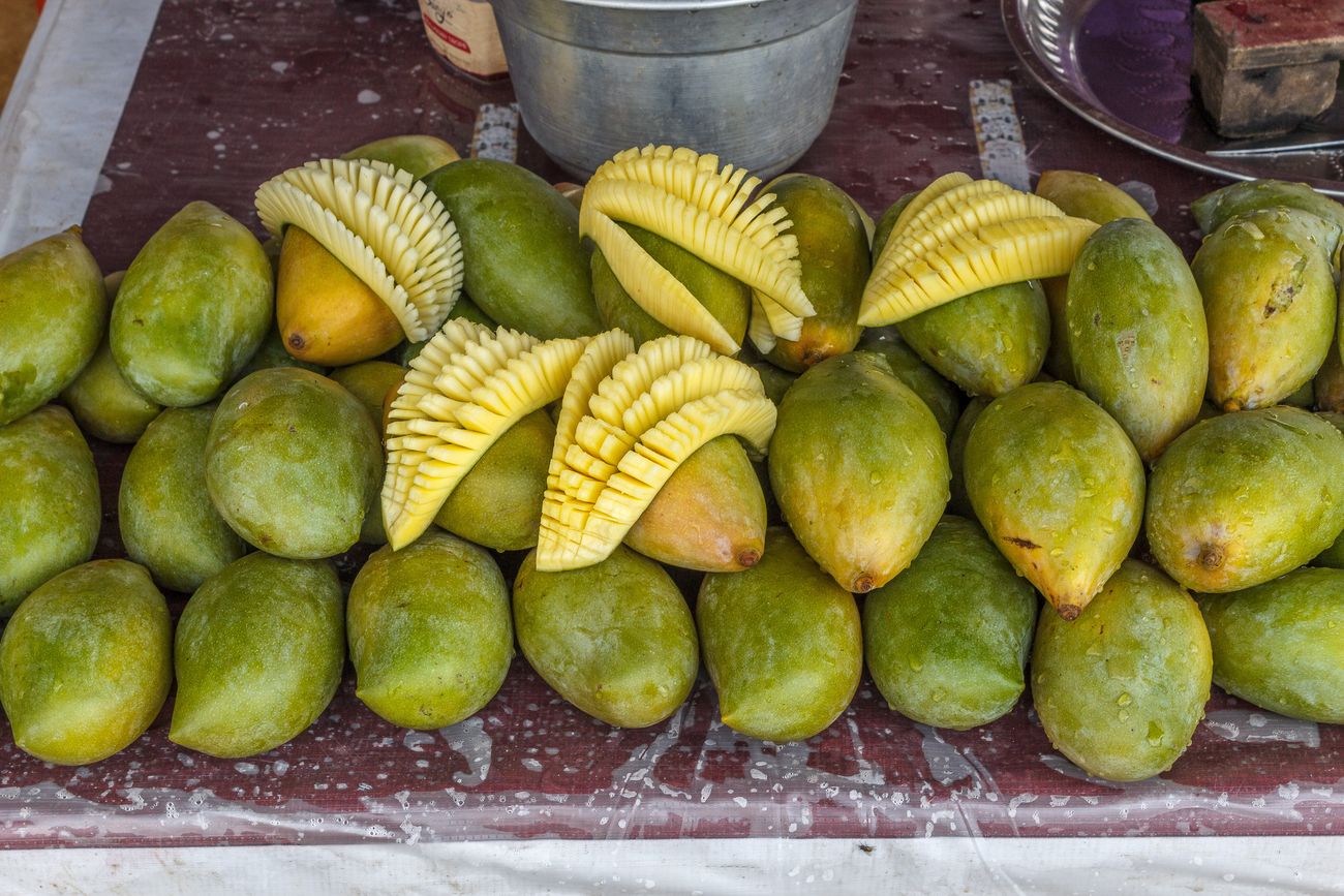 Beautifully displayed ripe mango slices to make the mouth water; a local entrepreneur at his best