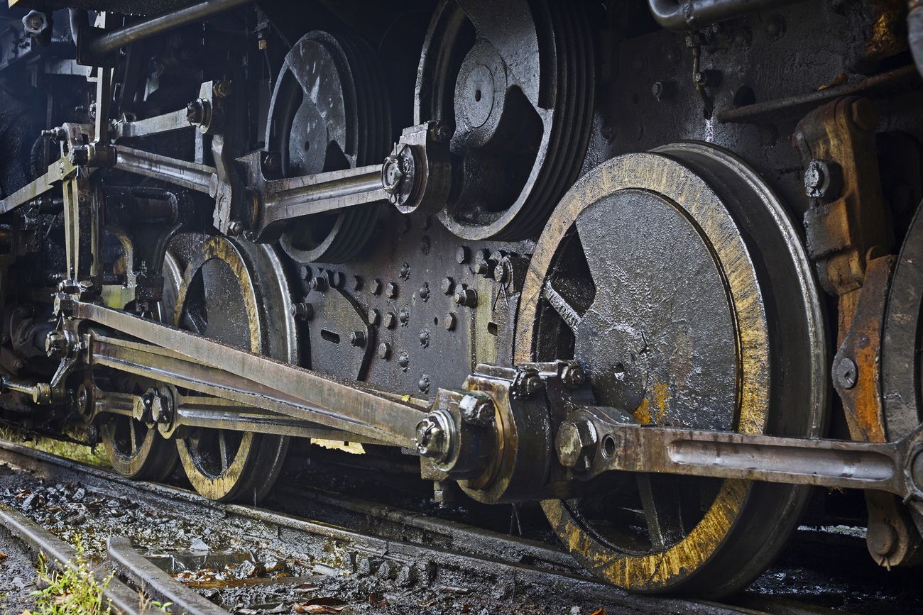A close up shot of the old-school wheels and rods of the steam locomotive giant that is adored by all, a glimpse into the history of this train that was started in 1879
