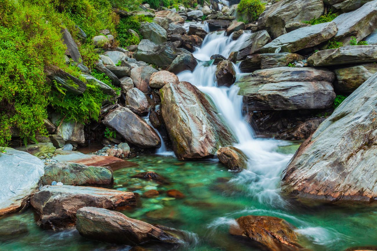 Crystal clear water cascading down one of Bagsu’s waterfalls 