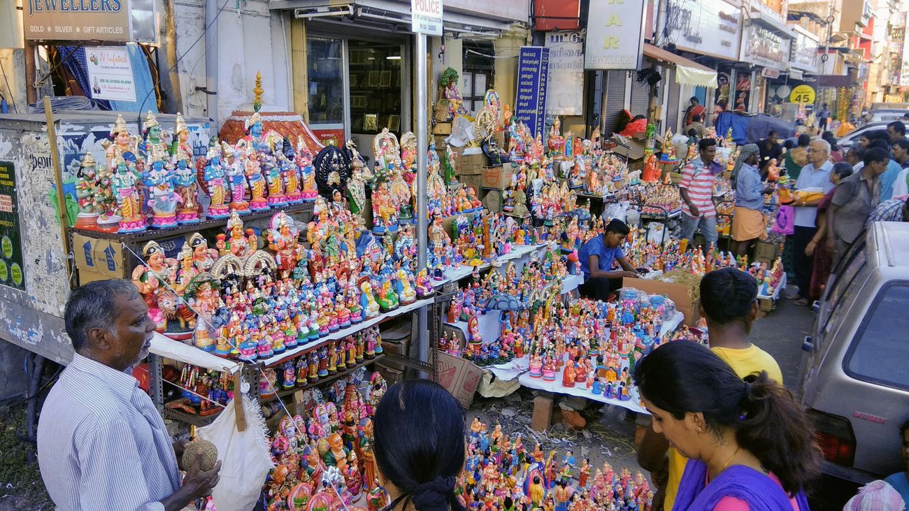 During the Hindu Navratri Festival, customers bargain at colorful street stalls during the Bommai Golu Doll Festival
