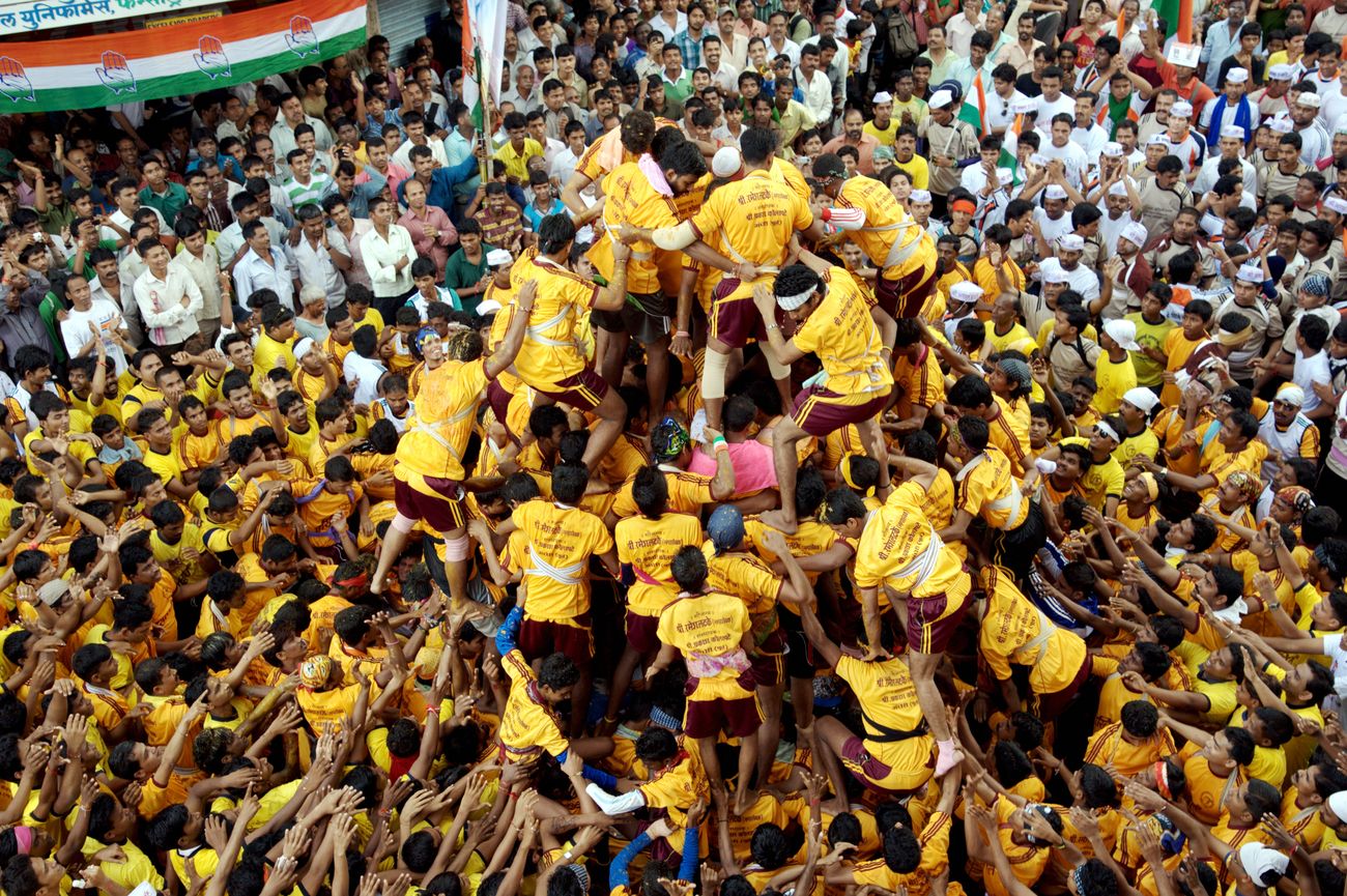 Dahi Handi festival is celebrated in Mumbai with great enthusiasm. People create human pyramids to try stealing butter from neighboring houses