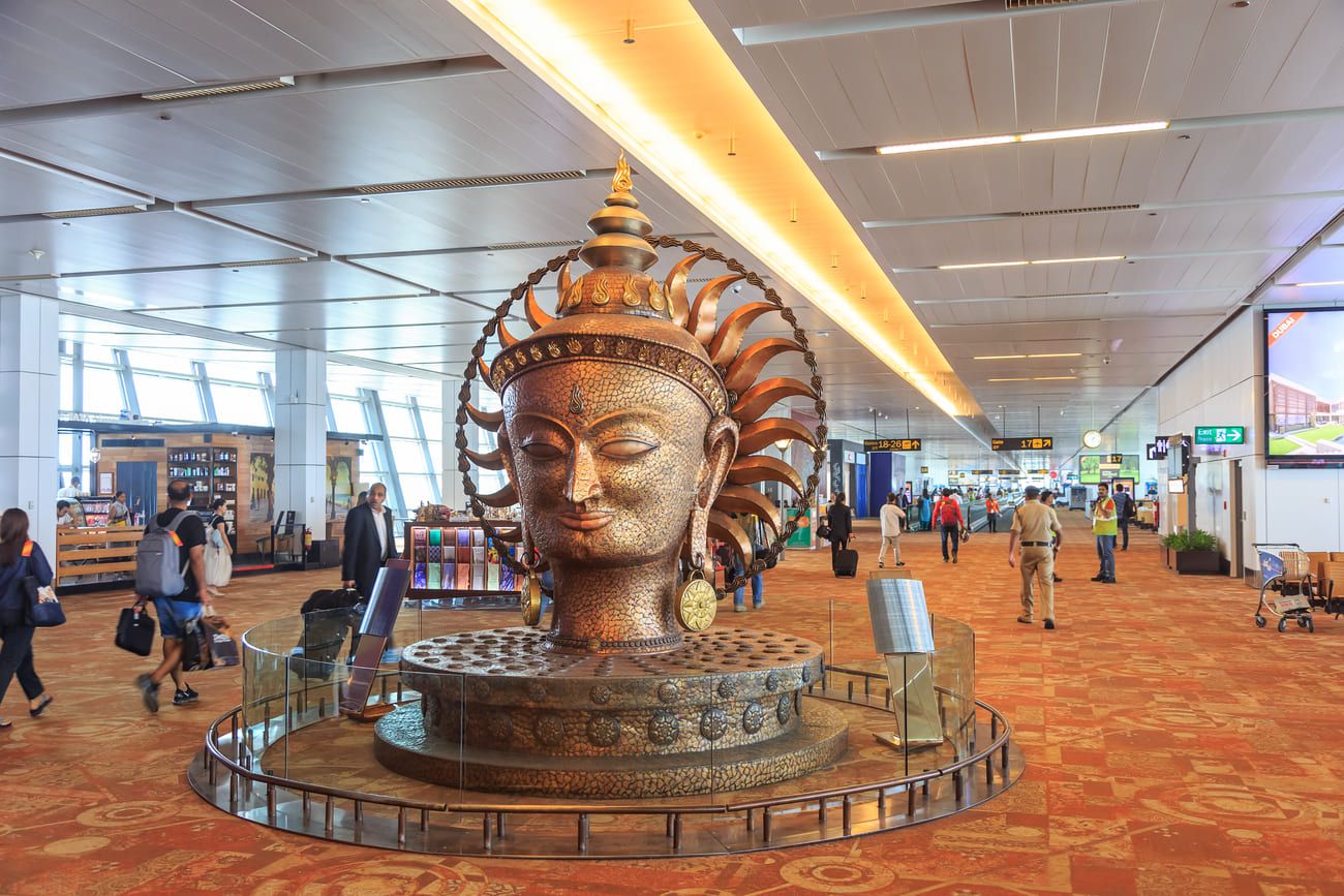 Departure hall at Indira Gandhi International Airport showcasing a beautiful artwork 