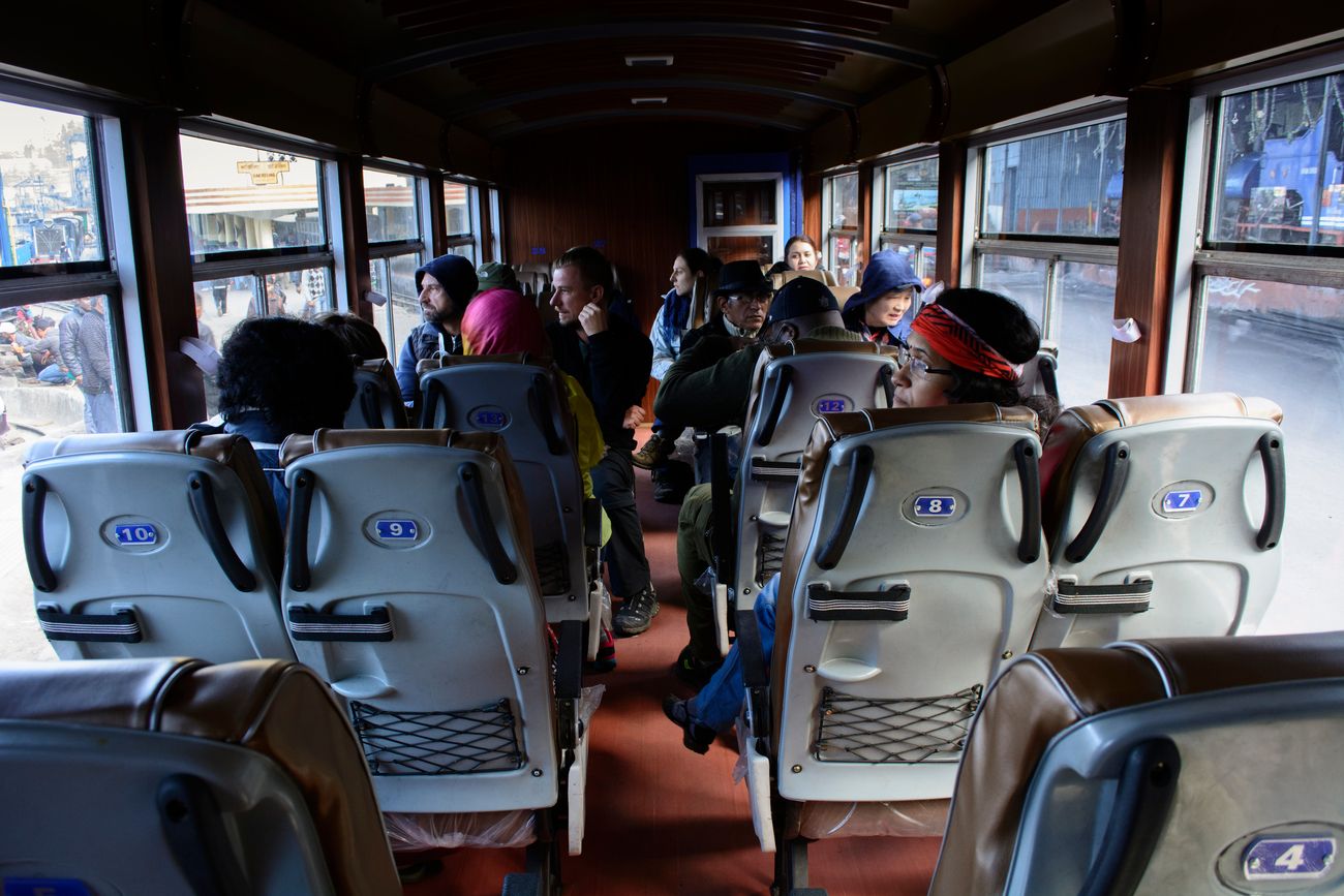 Given the narrow gauge of the Darjeeling Himalayan Railway Train, the interior of the train includes a chair car seating arrangement for passengers