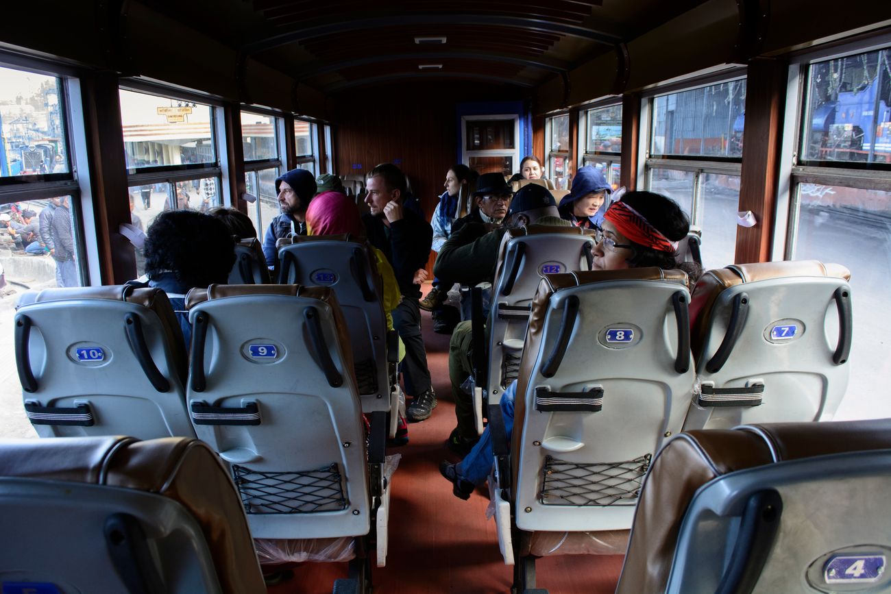 Given the narrow gauge of the Darjeeling Himalayan Railway Train, the interior of the train includes a chair car seating arrangement for passengers 