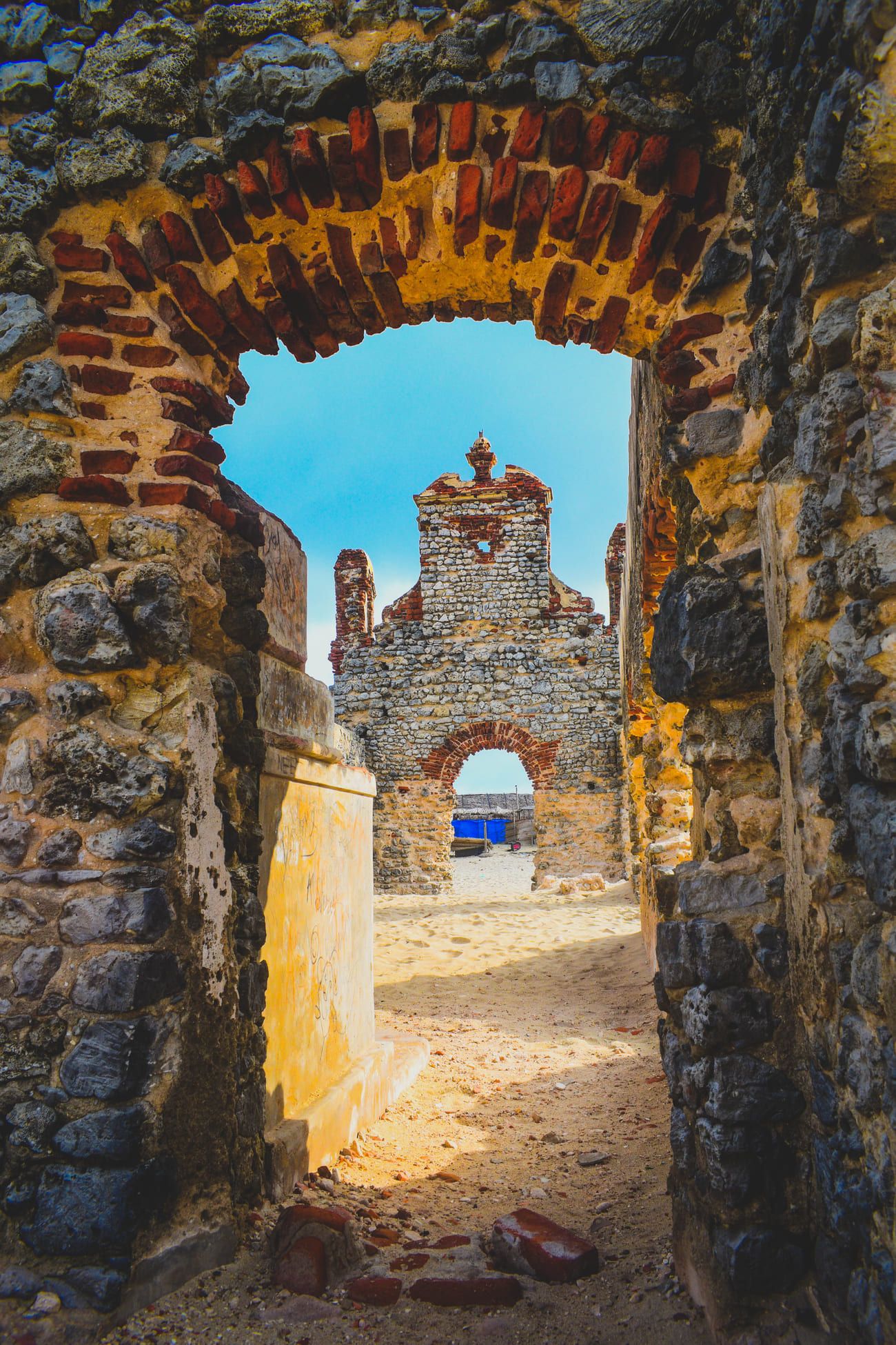 Intriguing view through the ruins of a ghost town on Pamban Island towards Dhanushkodi Beach 